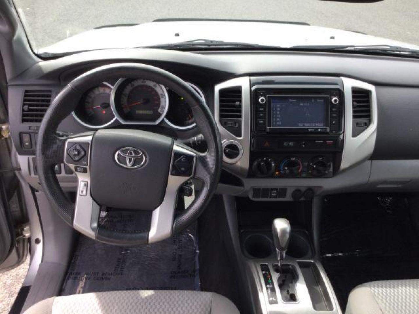 2014 SILVER /Graphite Toyota Tacoma Double Cab Long Bed V6 5AT 4WD (5TFMU4FNXEX) with an 4.0L V6 DOHC 24V engine, 5-Speed Automatic transmission, located at 1801 Main Street, Lewiston, 83501, (208) 743-9371, 46.417065, -117.004799 - Photo#5