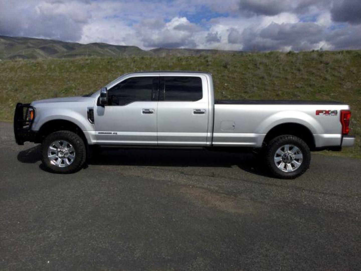 2019 Ingot Silver Metallic /Black Ford F-350 Platinum Crew Cab Long Bed 4WD (1FT8W3BT6KE) with an Powerstroke 6.7L V-8 diesel direct injection engine, 6-Speed Automatic transmission, located at 1801 Main Street, Lewiston, 83501, (208) 743-9371, 46.417065, -117.004799 - Photo#1