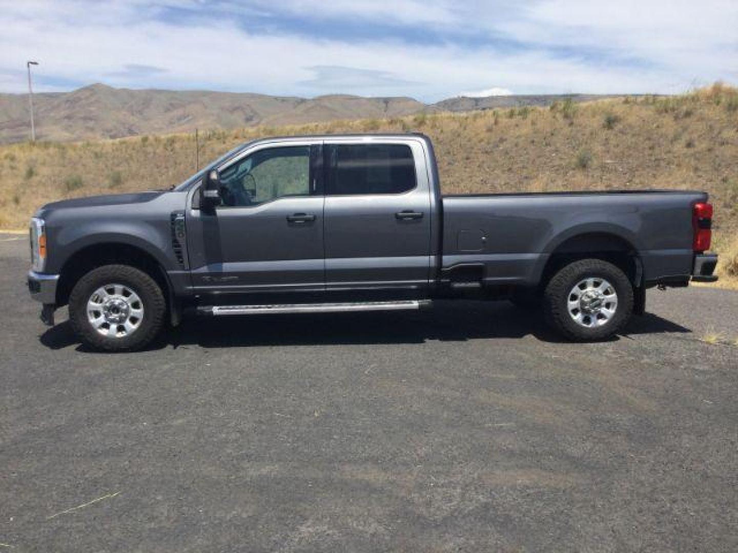 2023 Carbonized Gray Metallic /Medium Dark Slate Ford F-350 XLT (1FT8W3BT4PE) with an Powerstroke 6.7L V-8 diesel direct injection engine, 10 speed automatic transmission, located at 1801 Main Street, Lewiston, 83501, (208) 743-9371, 46.417065, -117.004799 - Photo#1