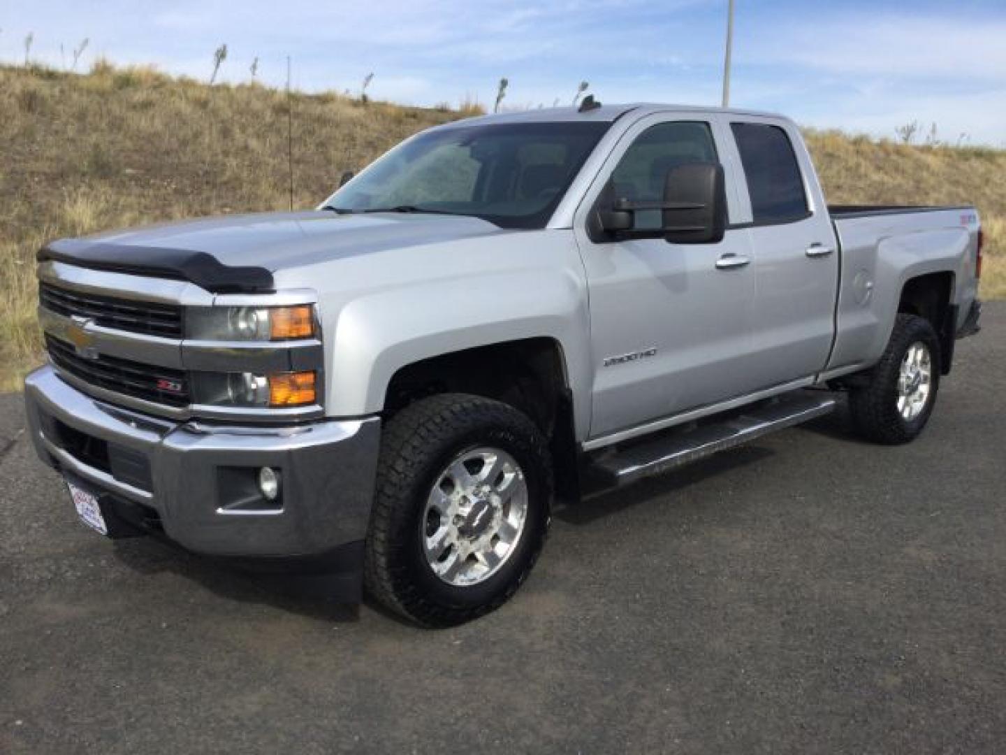 2015 Silver Ice Metallic /Jet Black Chevrolet Silverado 2500HD LT (1GC2KVEG3FZ) with an Vortec 6L V-8 variable valve control engine, 6-Speed Automatic transmission, located at 1801 Main Street, Lewiston, 83501, (208) 743-9371, 46.417065, -117.004799- Photo#0
