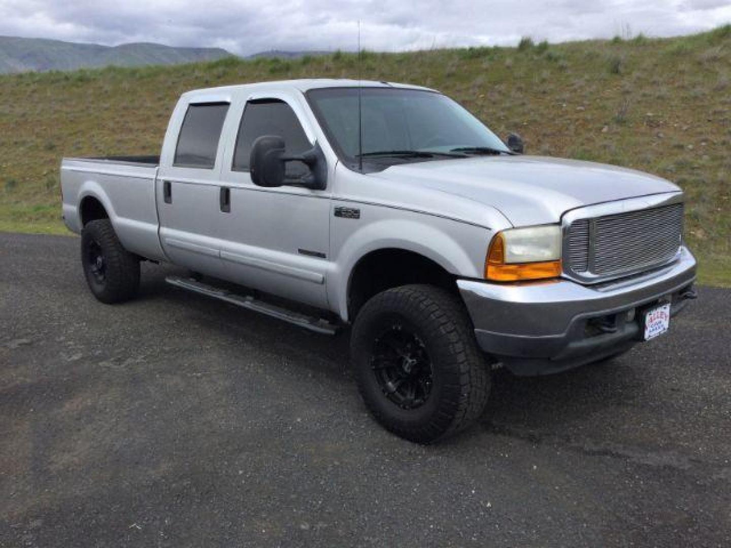 2001 Silver Clearcoat Metallic /Black Leather Ford F-250 XLT Crew Cab Long Bed 4WD (1FTNW21F11E) with an Powerstroke 7.3L V-8 diesel direct injection engine, 4 speed automatic transmission, located at 1801 Main Street, Lewiston, 83501, (208) 743-9371, 46.417065, -117.004799 - Photo#12