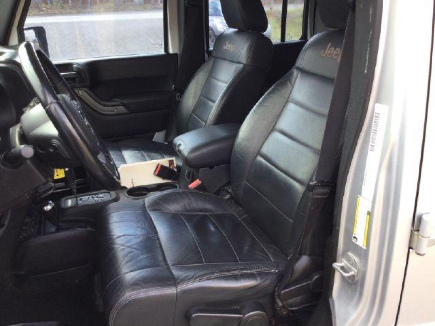 2012 Bright Silver Metallic Clearcoat /Black Jeep Wrangler Unlimited Sport (1C4BJWDG2CL) with an 3.6L V-6 DOHC engine, 5-Speed Automatic transmission, located at 1801 Main Street, Lewiston, 83501, (208) 743-9371, 46.417065, -117.004799 - Photo#3