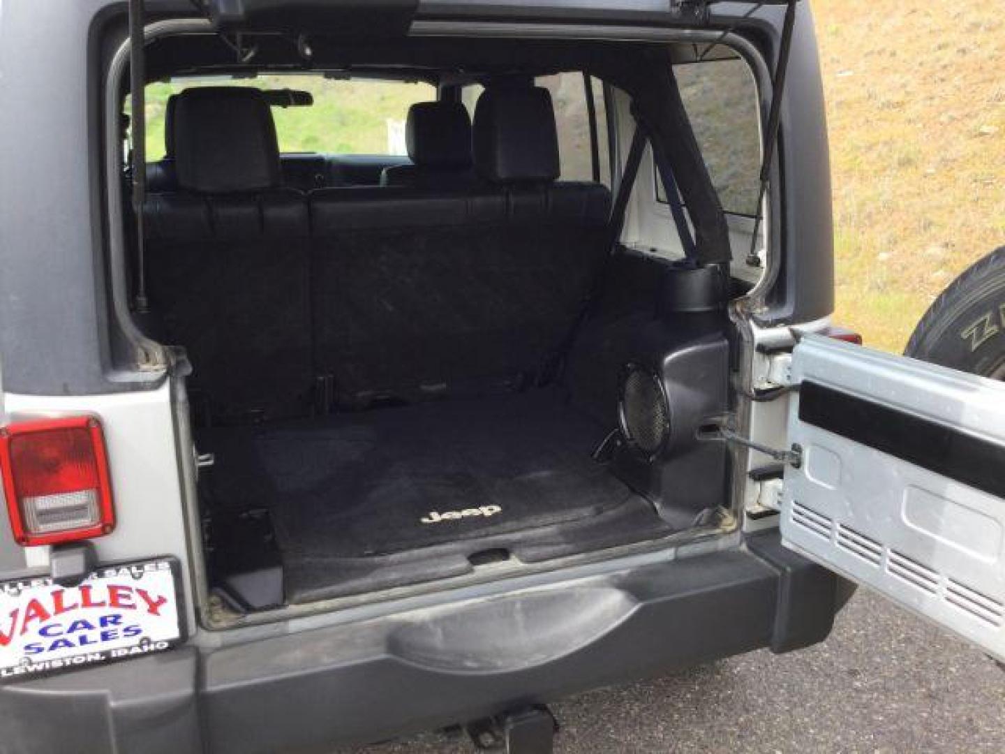 2012 Bright Silver Metallic Clearcoat /Black Jeep Wrangler Unlimited Sport (1C4BJWDG2CL) with an 3.6L V-6 DOHC engine, 5-Speed Automatic transmission, located at 1801 Main Street, Lewiston, 83501, (208) 743-9371, 46.417065, -117.004799 - Photo#6