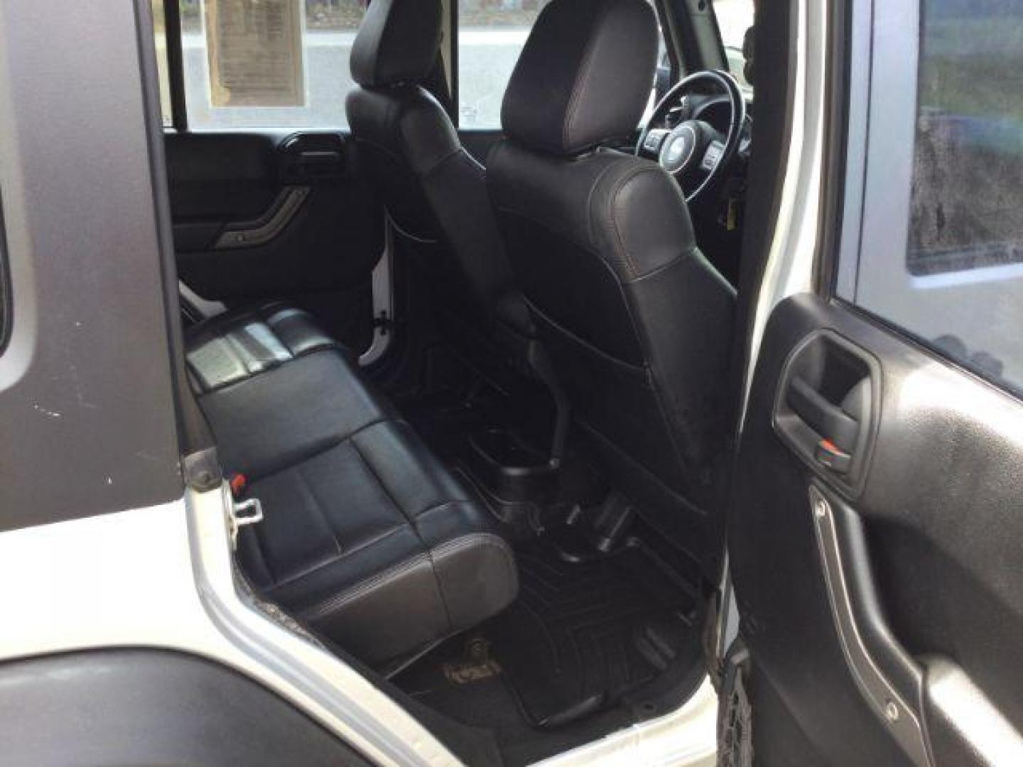 2012 Bright Silver Metallic Clearcoat /Black Jeep Wrangler Unlimited Sport (1C4BJWDG2CL) with an 3.6L V-6 DOHC engine, 5-Speed Automatic transmission, located at 1801 Main Street, Lewiston, 83501, (208) 743-9371, 46.417065, -117.004799 - Photo#7