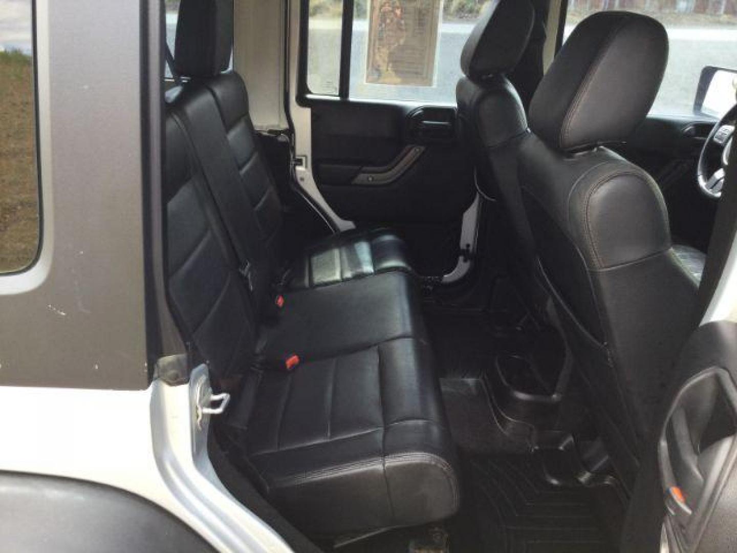 2012 Bright Silver Metallic Clearcoat /Black Jeep Wrangler Unlimited Sport (1C4BJWDG2CL) with an 3.6L V-6 DOHC engine, 5-Speed Automatic transmission, located at 1801 Main Street, Lewiston, 83501, (208) 743-9371, 46.417065, -117.004799 - Photo#8