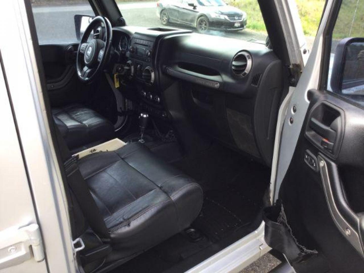 2012 Bright Silver Metallic Clearcoat /Black Jeep Wrangler Unlimited Sport (1C4BJWDG2CL) with an 3.6L V-6 DOHC engine, 5-Speed Automatic transmission, located at 1801 Main Street, Lewiston, 83501, (208) 743-9371, 46.417065, -117.004799 - Photo#9