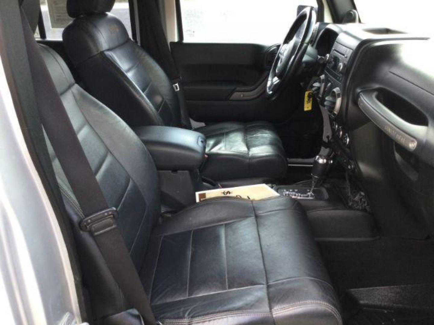 2012 Bright Silver Metallic Clearcoat /Black Jeep Wrangler Unlimited Sport (1C4BJWDG2CL) with an 3.6L V-6 DOHC engine, 5-Speed Automatic transmission, located at 1801 Main Street, Lewiston, 83501, (208) 743-9371, 46.417065, -117.004799 - Photo#10