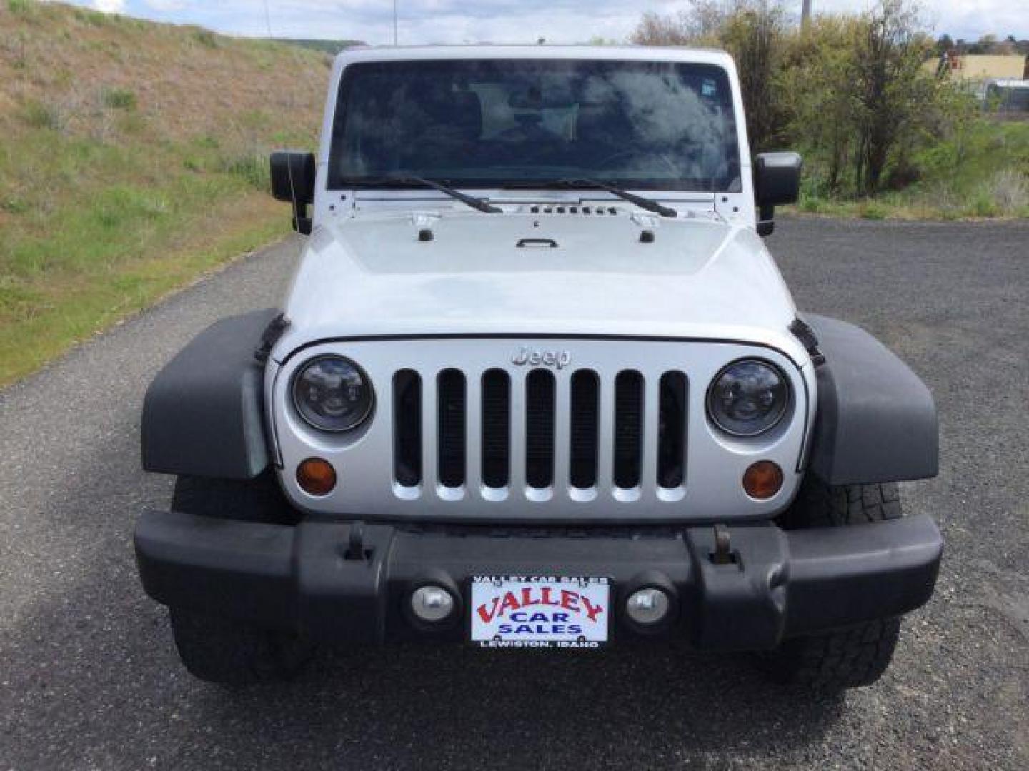2012 Bright Silver Metallic Clearcoat /Black Jeep Wrangler Unlimited Sport (1C4BJWDG2CL) with an 3.6L V-6 DOHC engine, 5-Speed Automatic transmission, located at 1801 Main Street, Lewiston, 83501, (208) 743-9371, 46.417065, -117.004799 - Photo#11