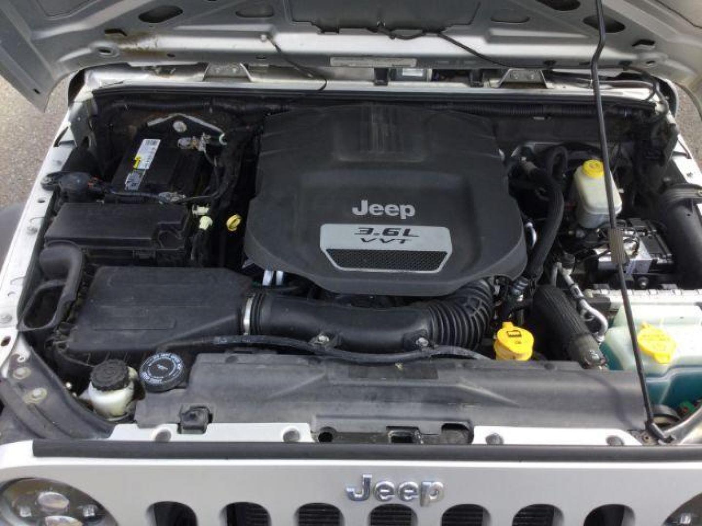 2012 Bright Silver Metallic Clearcoat /Black Jeep Wrangler Unlimited Sport (1C4BJWDG2CL) with an 3.6L V-6 DOHC engine, 5-Speed Automatic transmission, located at 1801 Main Street, Lewiston, 83501, (208) 743-9371, 46.417065, -117.004799 - Photo#15