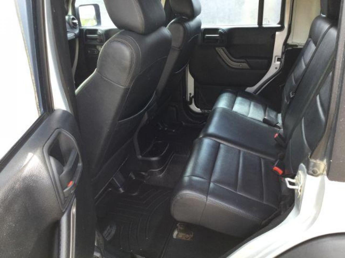 2012 Bright Silver Metallic Clearcoat /Black Jeep Wrangler Unlimited Sport (1C4BJWDG2CL) with an 3.6L V-6 DOHC engine, 5-Speed Automatic transmission, located at 1801 Main Street, Lewiston, 83501, (208) 743-9371, 46.417065, -117.004799 - Photo#17
