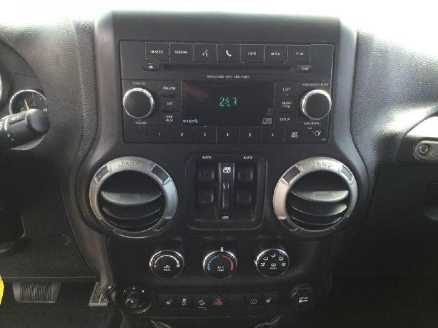 2012 Bright Silver Metallic Clearcoat /Black Jeep Wrangler Unlimited Sport (1C4BJWDG2CL) with an 3.6L V-6 DOHC engine, 5-Speed Automatic transmission, located at 1801 Main Street, Lewiston, 83501, (208) 743-9371, 46.417065, -117.004799 - Photo#18