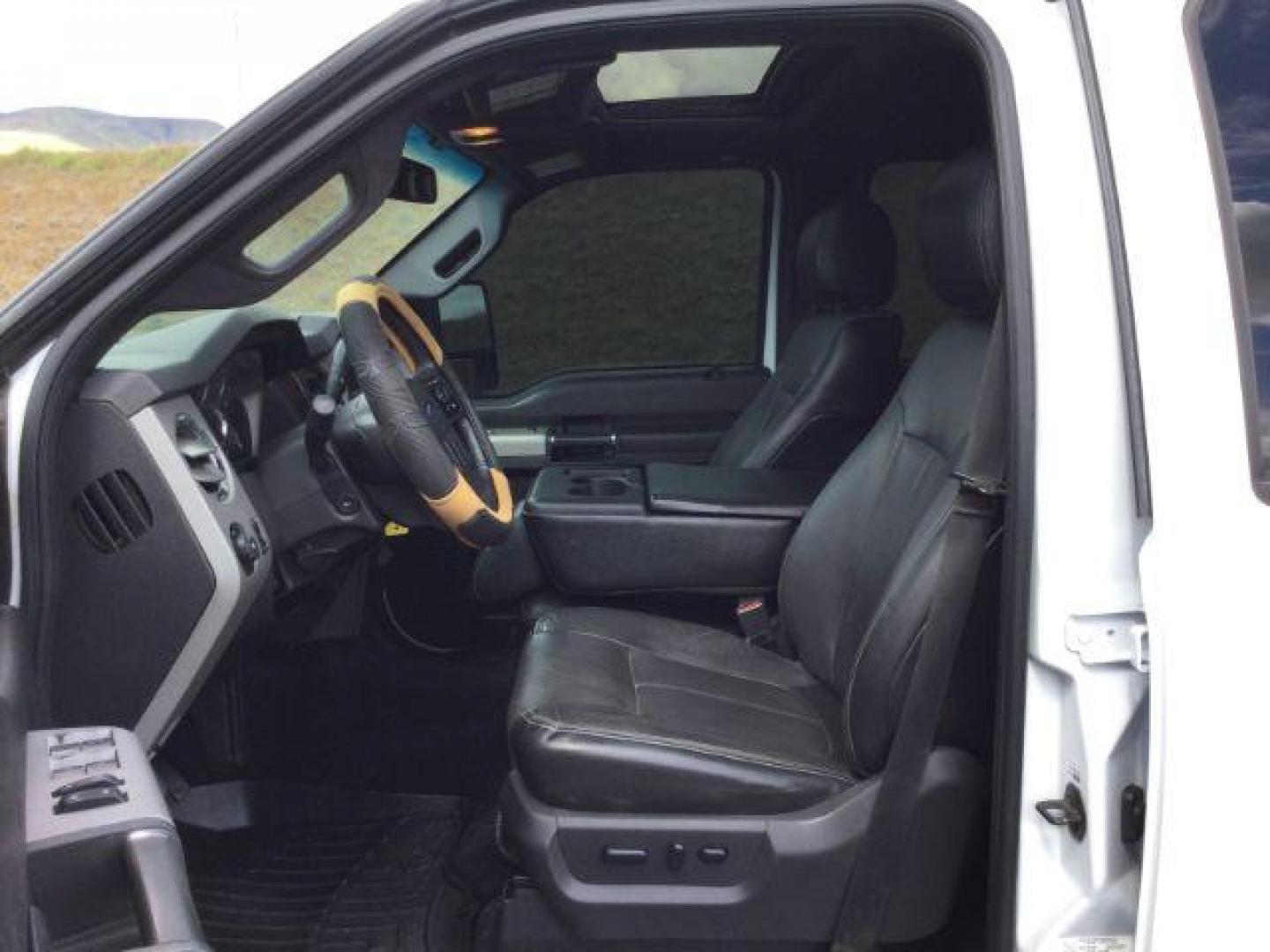 2015 Oxford White /Black Ford F-350 Crew Cab Lariat 4x4 (1FT8W3BT2FE) with an Powerstroke 6.7L V-8 diesel direct injection engine, 6-Speed Automatic transmission, located at 1801 Main Street, Lewiston, 83501, (208) 743-9371, 46.417065, -117.004799 - Photo#4