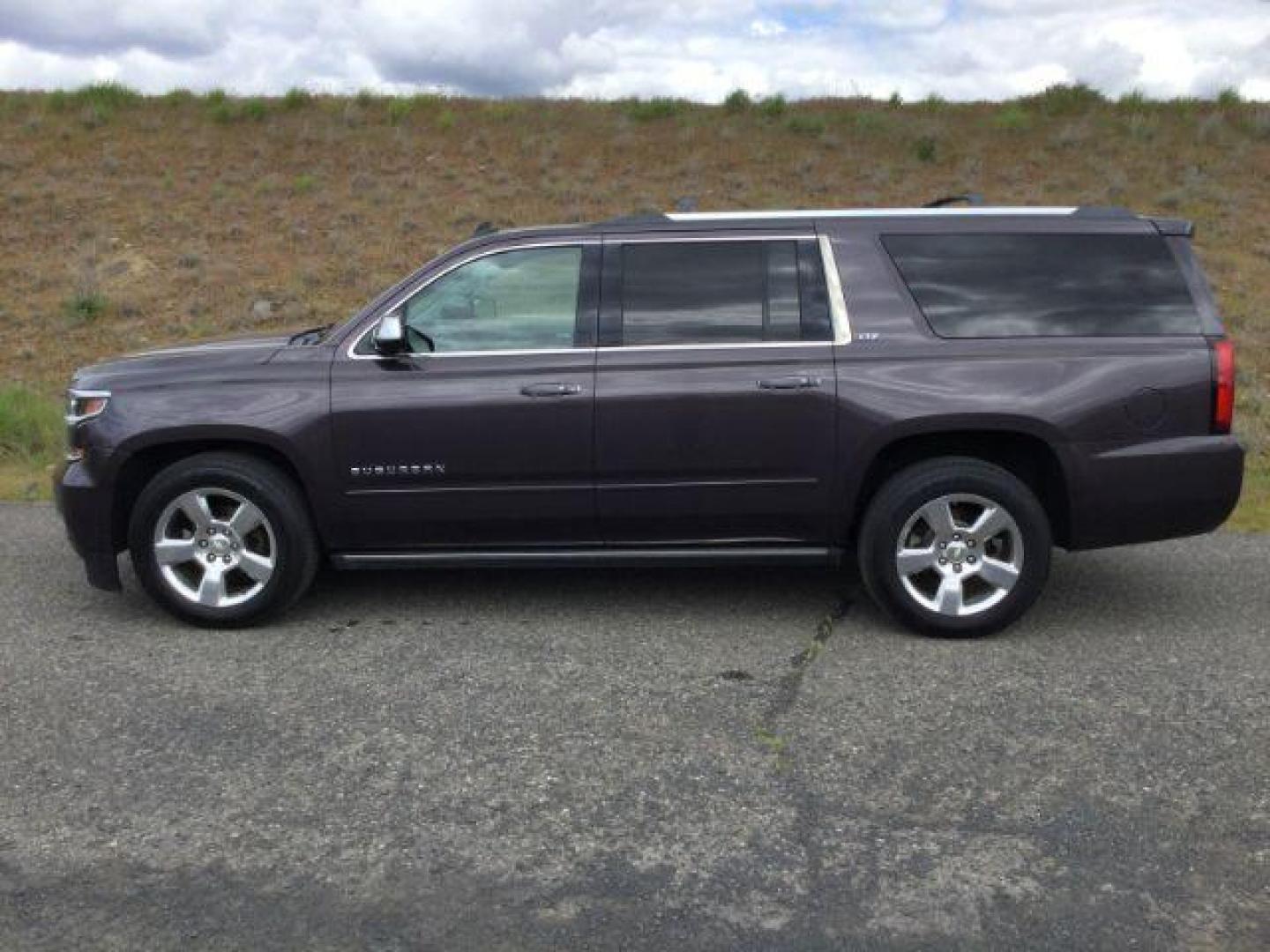 2015 Tungsten Metallic /Jet Black Chevrolet Suburban 1500 LTZ (1GNSKKKC7FR) with an EcoTec3 5.3L V-8 gasoline direct injection engine, 6-Speed Automatic transmission, located at 1801 Main Street, Lewiston, 83501, (208) 743-9371, 46.417065, -117.004799 - Photo#1
