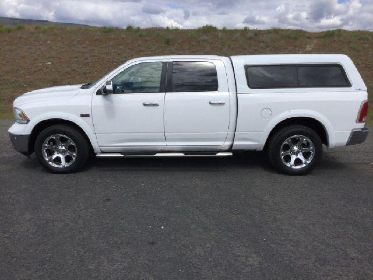 2017 Bright White /Black Ram 1500 Laramie (1C6RR7VT1HS) with an HEMI 5.7L V-8 variable valve control engine, 8-Speed Automatic transmission, located at 1801 Main Street, Lewiston, 83501, (208) 743-9371, 46.417065, -117.004799 - Photo#1