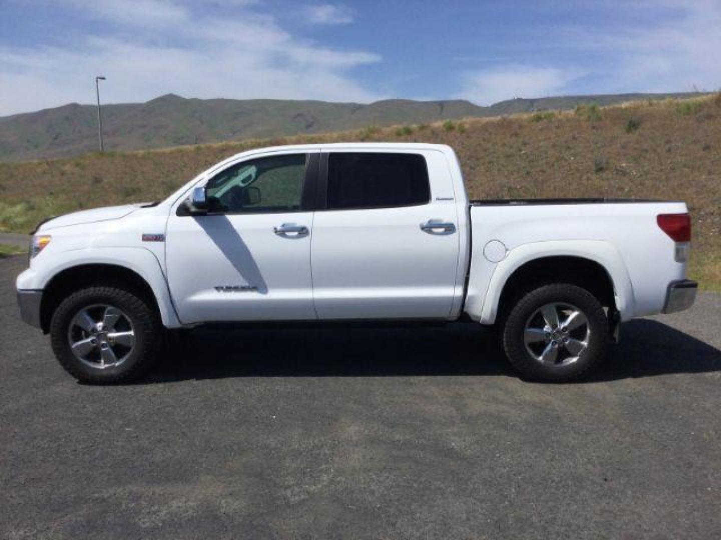 2012 Super White /Black Toyota Tundra Platinum Crew Max 4x4 (5TFHY5F10CX) with an I-FORCE 5.7L V-8 DOHC engine, 6-Speed Automatic transmission, located at 1801 Main Street, Lewiston, 83501, (208) 743-9371, 46.417065, -117.004799 - Photo#1