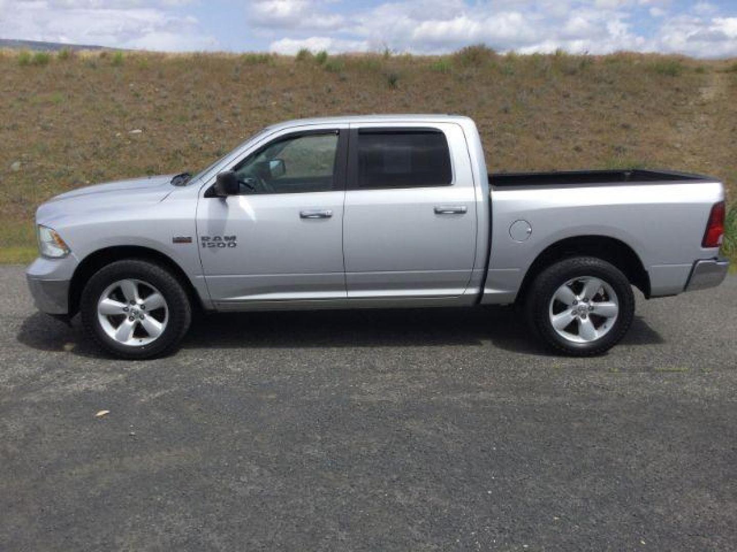 2013 Bright Silver Metallic Clearcoat /Diesel Gray/Black Ram 1500 SLT (1C6RR7LT0DS) with an HEMI 5.7L V-8 variable valve control engine, 6-Speed Automatic transmission, located at 1801 Main Street, Lewiston, 83501, (208) 743-9371, 46.417065, -117.004799 - Photo#1