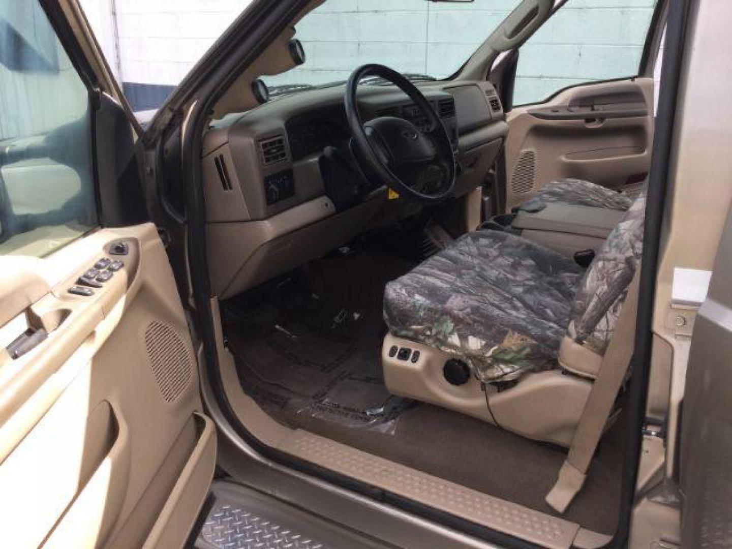 2004 Arizona Beige Metallic /Castano Leather Interior Ford F-350 Lariat Crew Cab Long Bed 4WD (1FTSW31P94E) with an 6.0L V8 OHV 32V TURBO DIESEL engine, 6-Speed Manual transmission, located at 1801 Main Street, Lewiston, 83501, (208) 743-9371, 46.417065, -117.004799 - Photo#4