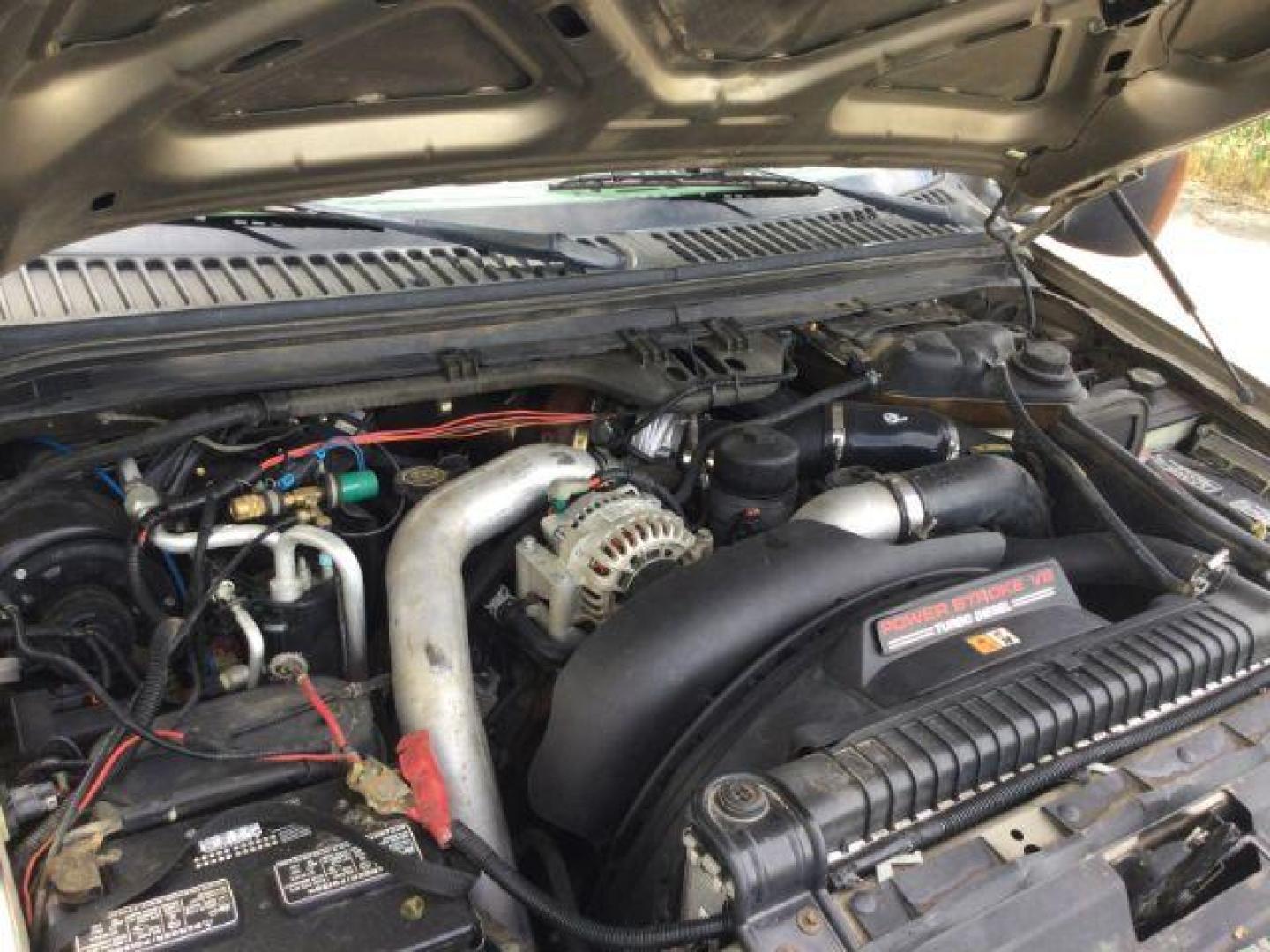 2004 Arizona Beige Metallic /Castano Leather Interior Ford F-350 Lariat Crew Cab Long Bed 4WD (1FTSW31P94E) with an 6.0L V8 OHV 32V TURBO DIESEL engine, 6-Speed Manual transmission, located at 1801 Main Street, Lewiston, 83501, (208) 743-9371, 46.417065, -117.004799 - Photo#24