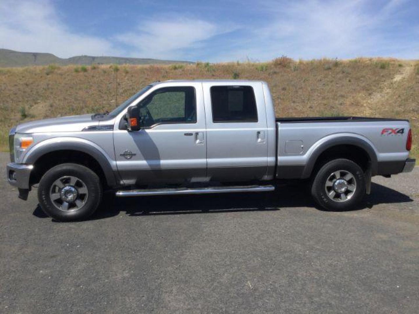 2012 Ingot Silver Metallic /Black Ford F-250 LARIAT (1FT7W2BT1CE) with an Powerstroke 6.7L V-8 diesel direct injection engine, 6-Speed Automatic transmission, located at 1801 Main Street, Lewiston, 83501, (208) 743-9371, 46.417065, -117.004799 - Photo#1