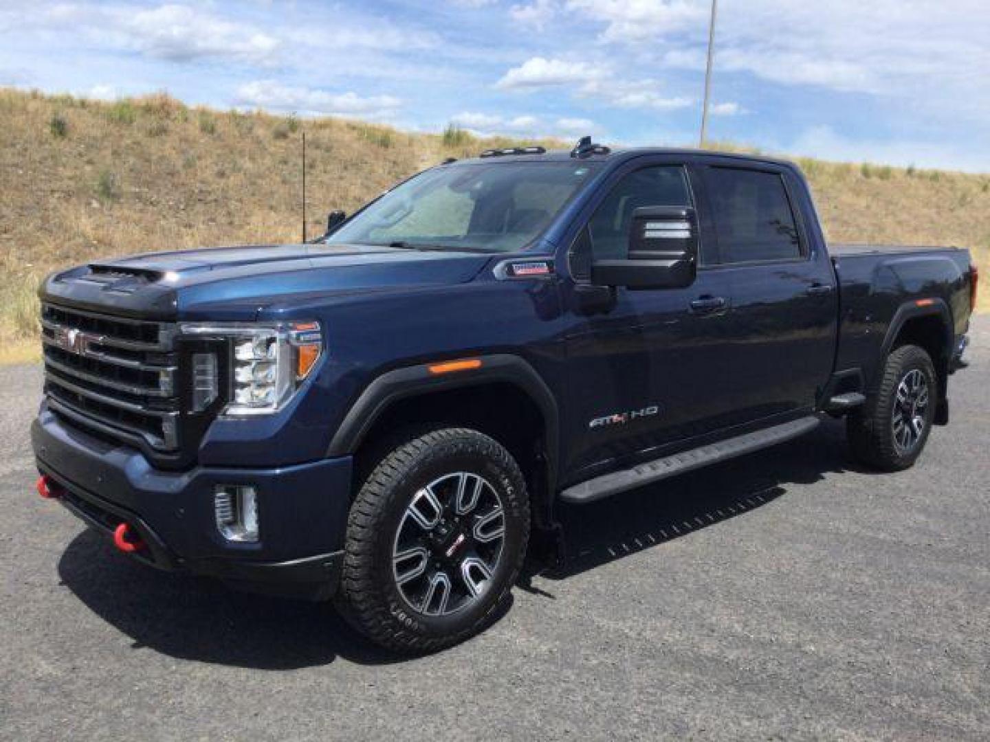 2022 Pacific Blue Metallic /Jet Black w/Kalahari Accents GMC Sierra 2500HD AT4 (1GT49PEY2NF) with an 6.6L V-8 gasoline direct injection engine, 10-speed automatic transmission, located at 1801 Main Street, Lewiston, 83501, (208) 743-9371, 46.417065, -117.004799 - Photo#1