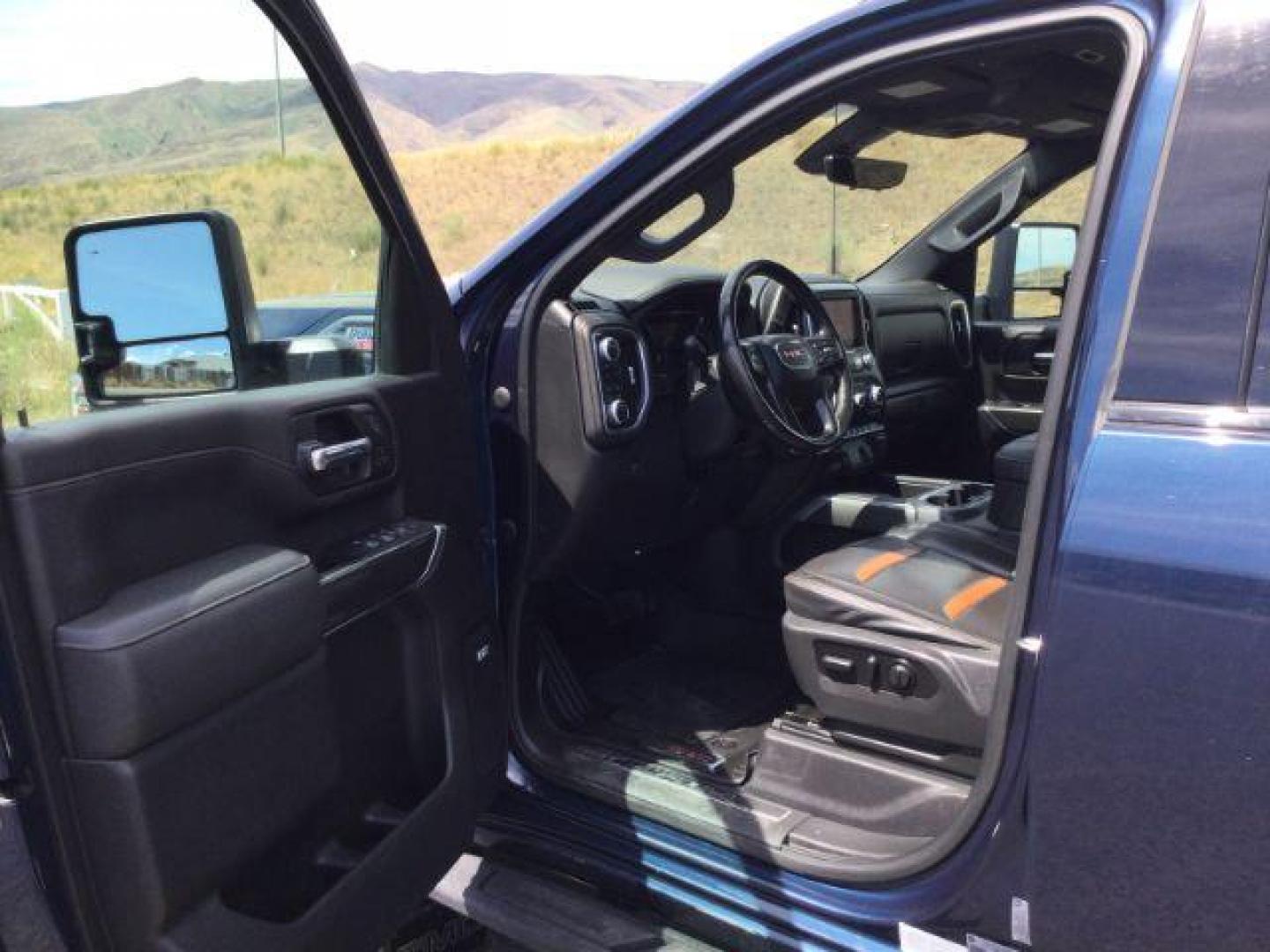 2022 Pacific Blue Metallic /Jet Black w/Kalahari Accents GMC Sierra 2500HD AT4 (1GT49PEY2NF) with an 6.6L V-8 gasoline direct injection engine, 10-speed automatic transmission, located at 1801 Main Street, Lewiston, 83501, (208) 743-9371, 46.417065, -117.004799 - Photo#3