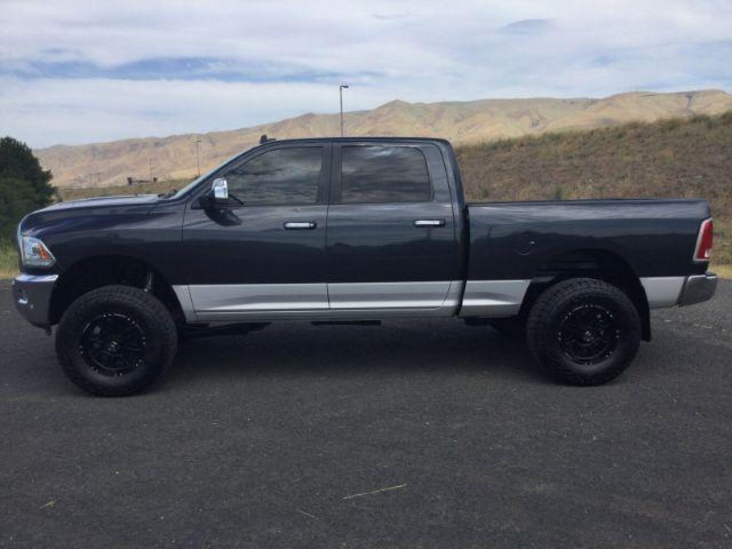 2017 Maximum Steel Metallic Clearcoat /Black Ram 2500 Laramie Crew Cab 4x4 6'4 Box (3C6UR5FL8HG) with an Cummins 6.7L I-6 diesel direct injection engine, 6-Speed Automatic transmission, located at 1801 Main Street, Lewiston, 83501, (208) 743-9371, 46.417065, -117.004799 - Photo#1