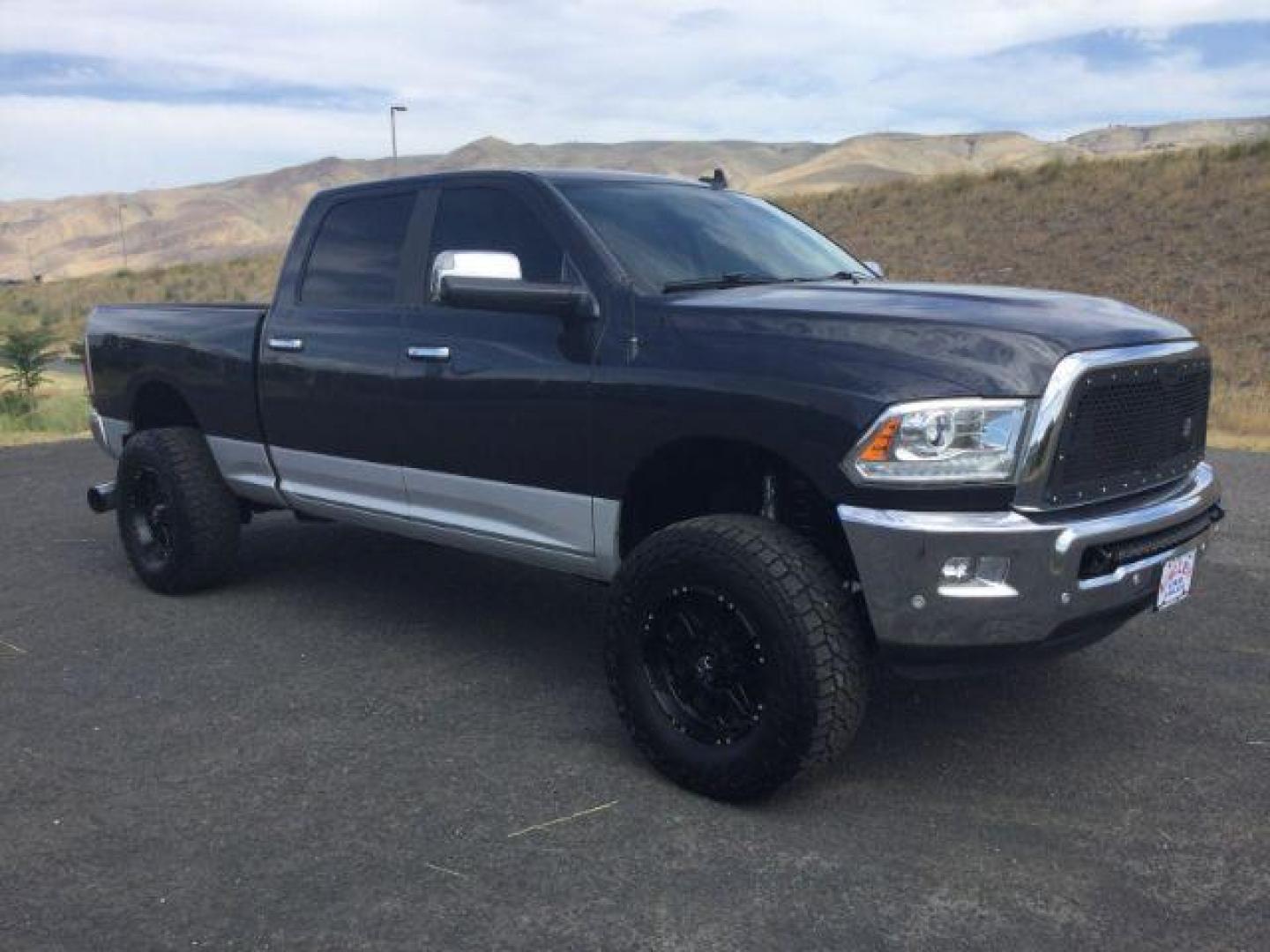 2017 Maximum Steel Metallic Clearcoat /Black Ram 2500 Laramie Crew Cab 4x4 6'4 Box (3C6UR5FL8HG) with an Cummins 6.7L I-6 diesel direct injection engine, 6-Speed Automatic transmission, located at 1801 Main Street, Lewiston, 83501, (208) 743-9371, 46.417065, -117.004799 - Photo#4