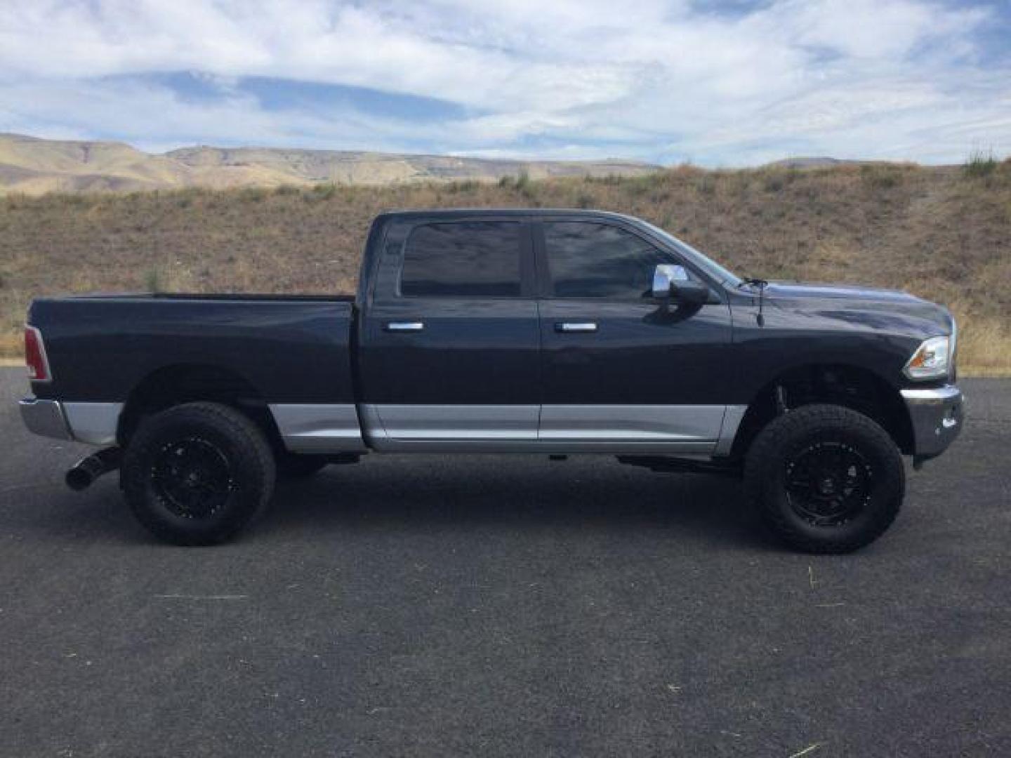 2017 Maximum Steel Metallic Clearcoat /Black Ram 2500 Laramie Crew Cab 4x4 6'4 Box (3C6UR5FL8HG) with an Cummins 6.7L I-6 diesel direct injection engine, 6-Speed Automatic transmission, located at 1801 Main Street, Lewiston, 83501, (208) 743-9371, 46.417065, -117.004799 - Photo#5