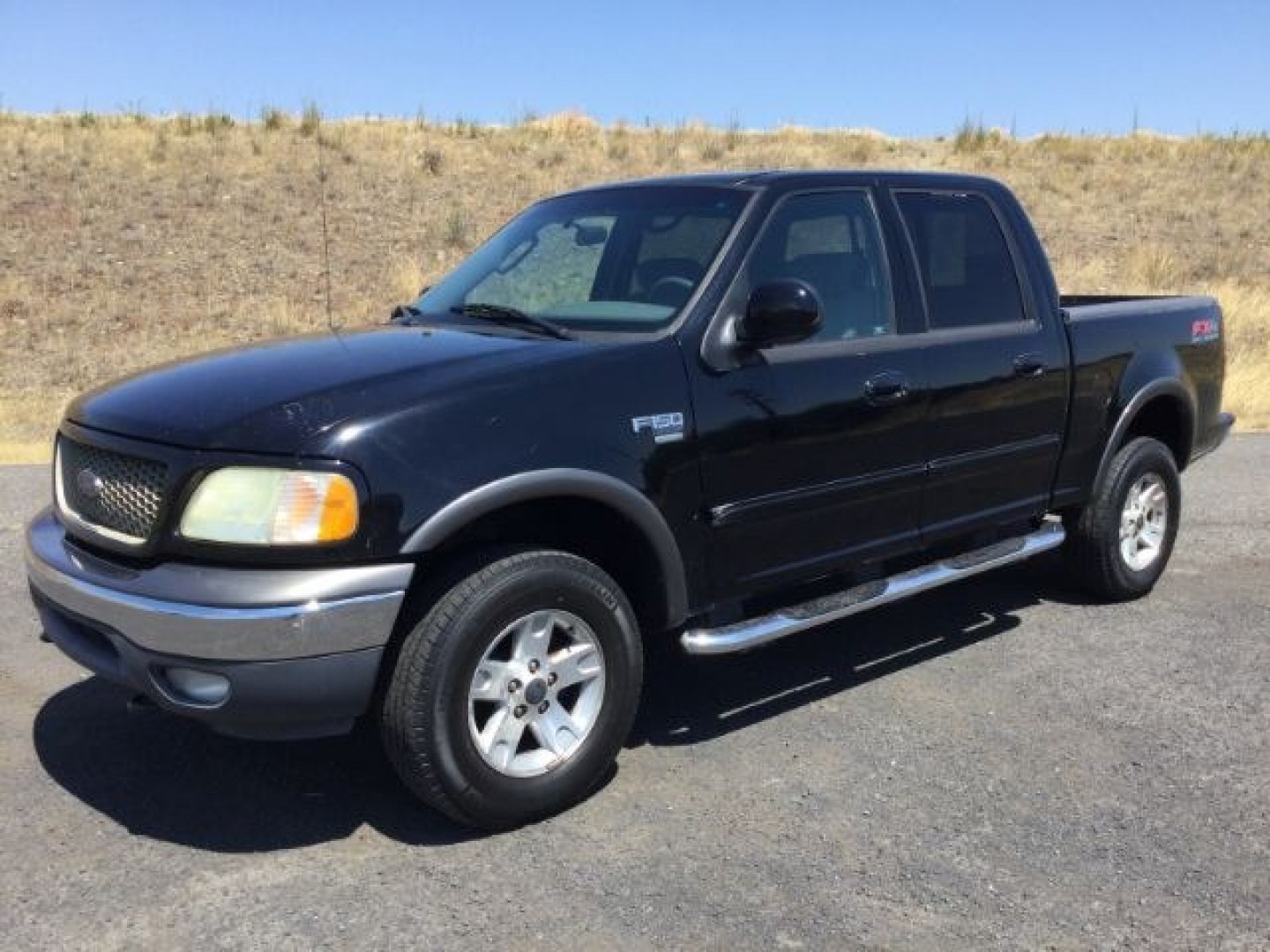 2003 Black Clearcoat /Medium Graphite Ford F-150 XLT (1FTRW08LX3K) with an Triton 5.4L V-8 regular unleaded engine, automatic transmission, located at 1801 Main Street, Lewiston, 83501, (208) 743-9371, 46.417065, -117.004799- Photo#0