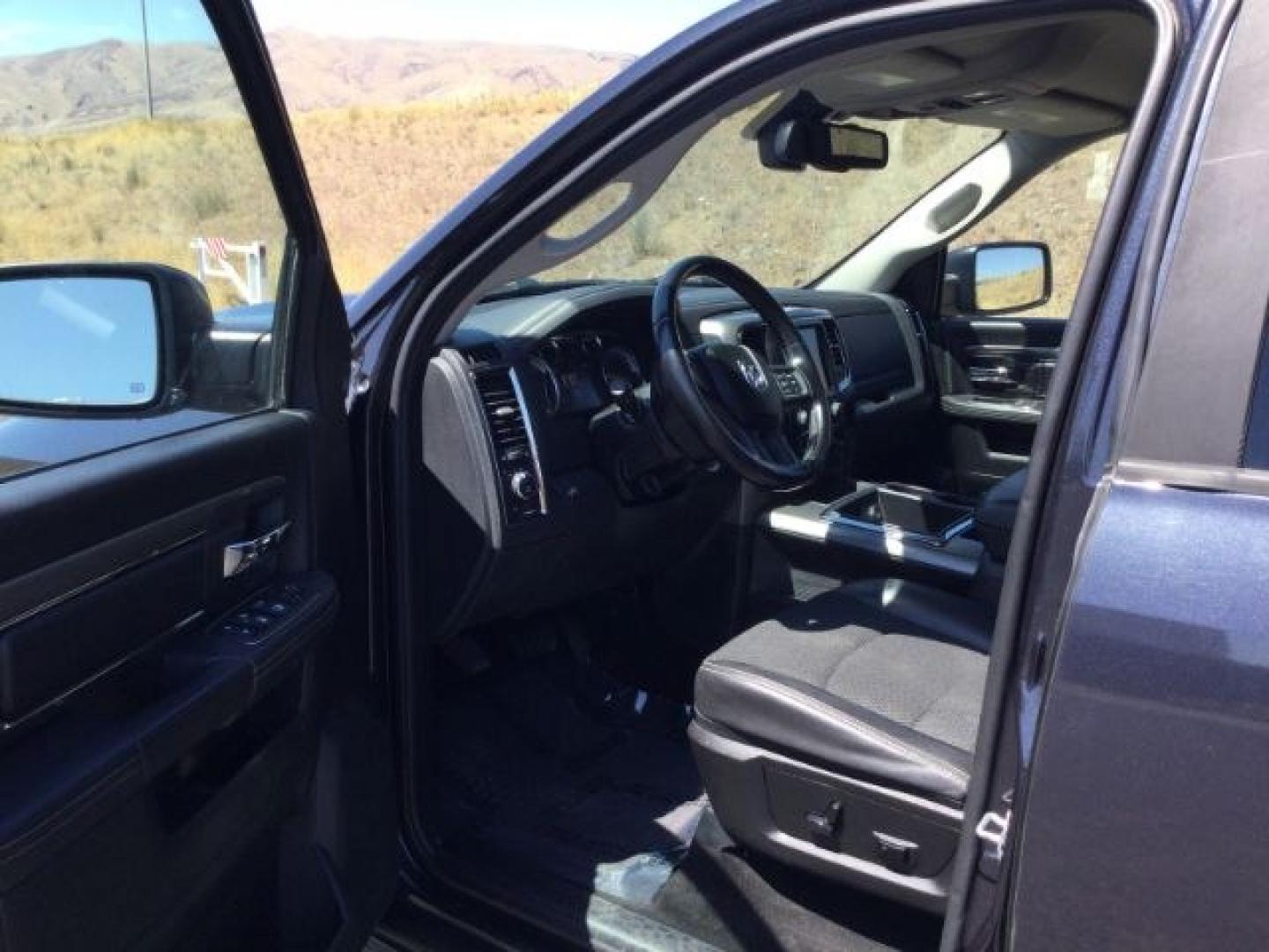 2015 Maximum Steel Metallic /Black Ram 1500 Sport (1C6RR7UT4FS) with an HEMI 5.7L V-8 variable valve control engine, 8 Speed Automatic transmission, located at 1801 Main Street, Lewiston, 83501, (208) 743-9371, 46.417065, -117.004799- Photo#3