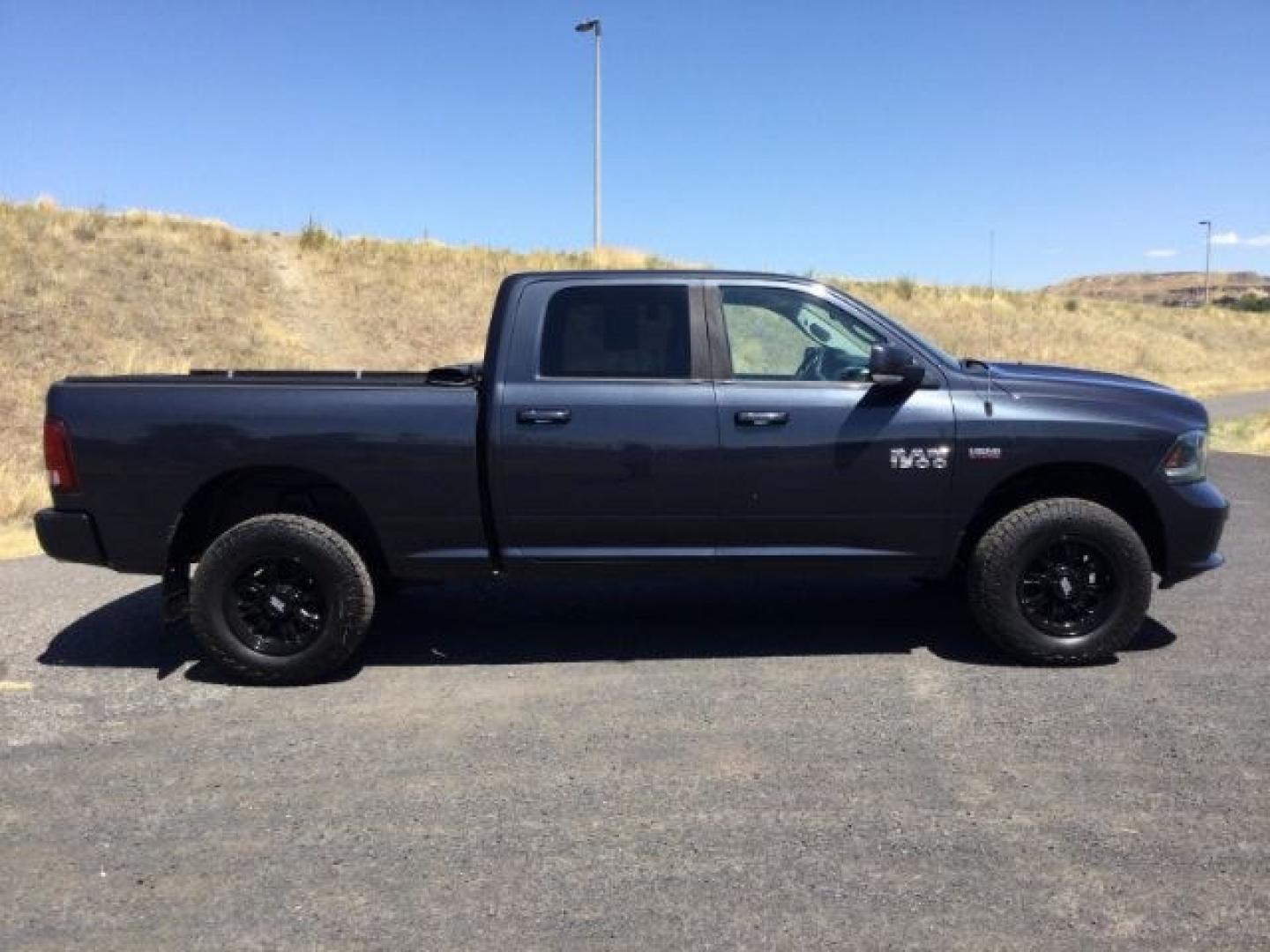 2015 Maximum Steel Metallic /Black Ram 1500 Sport (1C6RR7UT4FS) with an HEMI 5.7L V-8 variable valve control engine, 8 Speed Automatic transmission, located at 1801 Main Street, Lewiston, 83501, (208) 743-9371, 46.417065, -117.004799- Photo#19