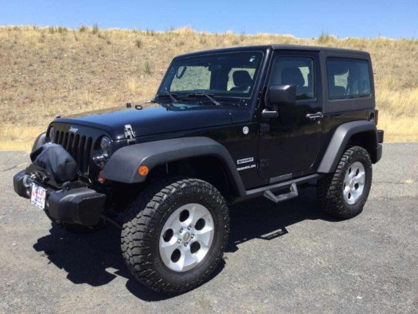 2011 Black with Black Hard Top /Black Cloth Interior Jeep Wrangler Sport 4WD (1J4AA2D14BL) with an 3.8L V6 OHV 12V engine, 4-Speed Automatic transmission, located at 1801 Main Street, Lewiston, 83501, (208) 743-9371, 46.417065, -117.004799- Photo#0