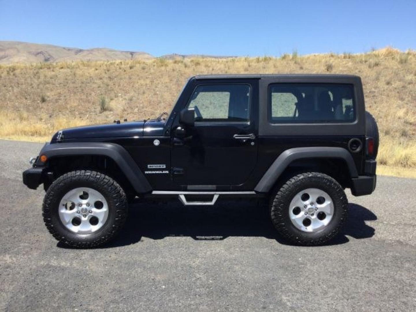 2011 Black with Black Hard Top /Black Cloth Interior Jeep Wrangler Sport 4WD (1J4AA2D14BL) with an 3.8L V6 OHV 12V engine, 4-Speed Automatic transmission, located at 1801 Main Street, Lewiston, 83501, (208) 743-9371, 46.417065, -117.004799- Photo#1