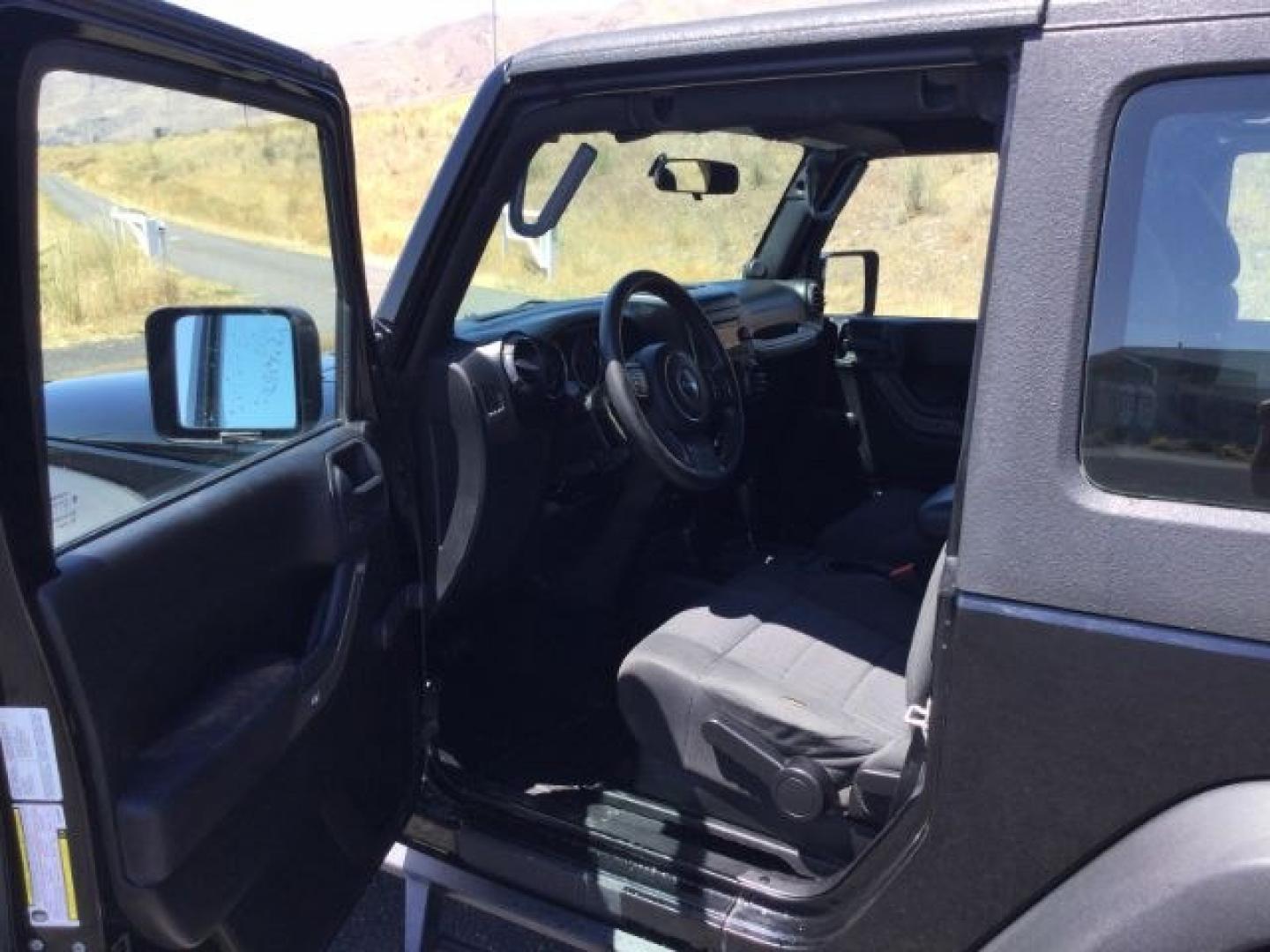 2011 Black with Black Hard Top /Black Cloth Interior Jeep Wrangler Sport 4WD (1J4AA2D14BL) with an 3.8L V6 OHV 12V engine, 4-Speed Automatic transmission, located at 1801 Main Street, Lewiston, 83501, (208) 743-9371, 46.417065, -117.004799- Photo#3