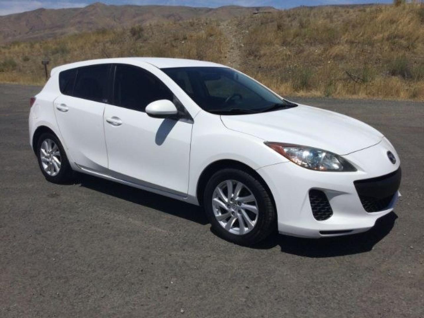 2012 Crystal White Pearl Mica /Black Mazda Mazda3 Hatchback i Touring (JM1BL1L72C1) with an SKYACTIV-G 2L I-4 gasoline direct injection engine, 6-Speed Automatic transmission, located at 1801 Main Street, Lewiston, 83501, (208) 743-9371, 46.417065, -117.004799- Photo#1