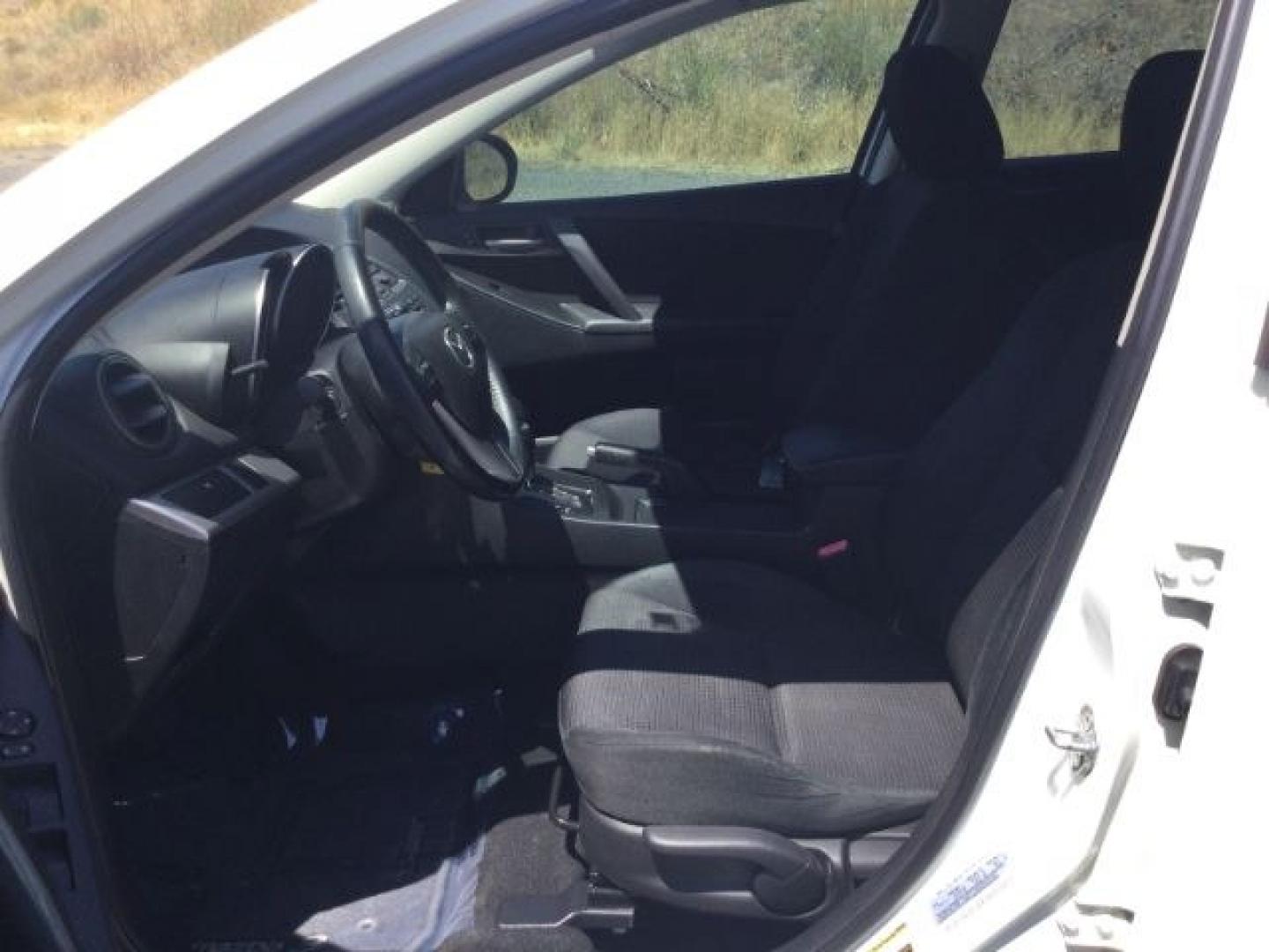 2012 Crystal White Pearl Mica /Black Mazda Mazda3 Hatchback i Touring (JM1BL1L72C1) with an SKYACTIV-G 2L I-4 gasoline direct injection engine, 6-Speed Automatic transmission, located at 1801 Main Street, Lewiston, 83501, (208) 743-9371, 46.417065, -117.004799- Photo#4