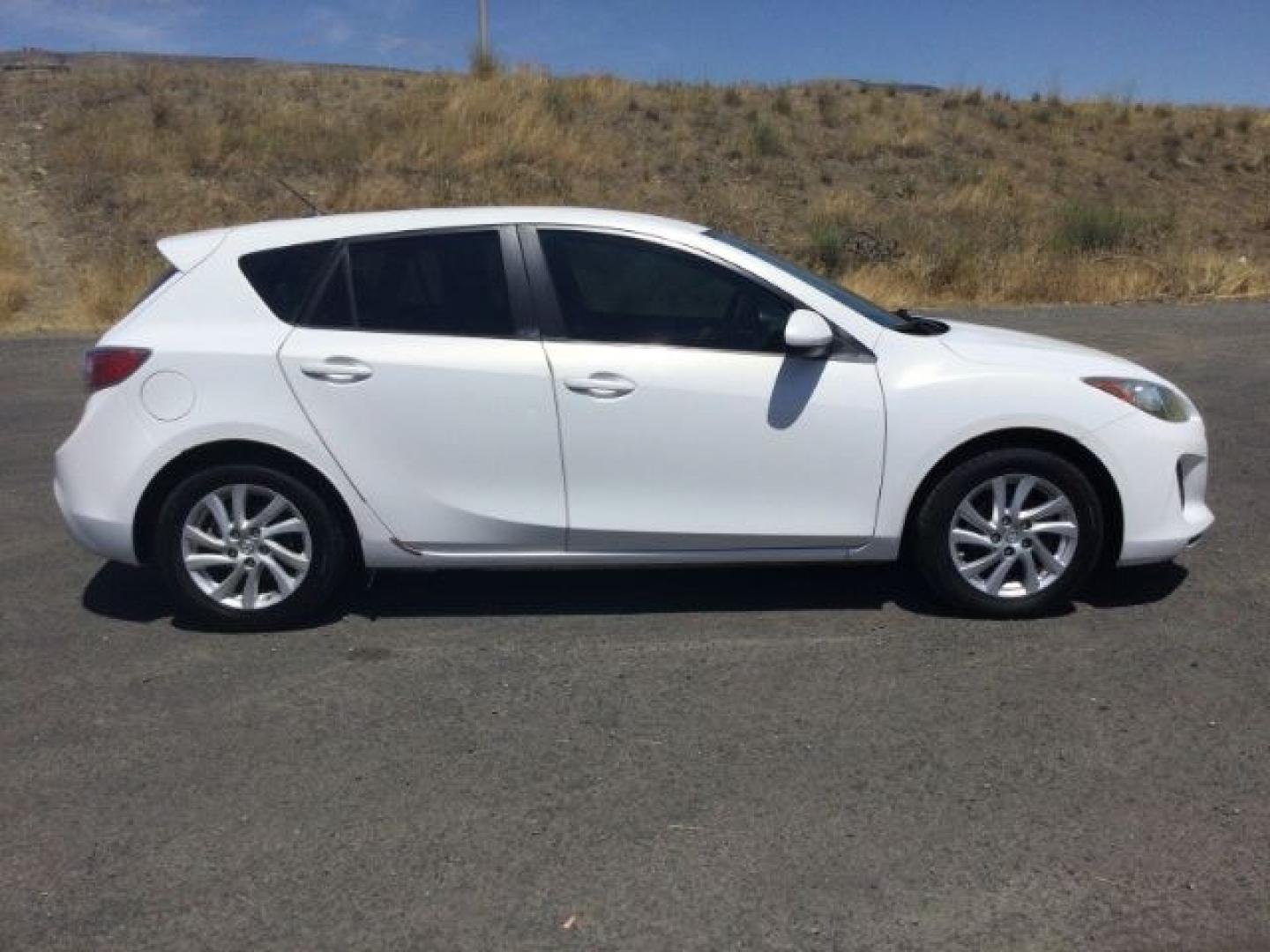 2012 Crystal White Pearl Mica /Black Mazda Mazda3 Hatchback i Touring (JM1BL1L72C1) with an SKYACTIV-G 2L I-4 gasoline direct injection engine, 6-Speed Automatic transmission, located at 1801 Main Street, Lewiston, 83501, (208) 743-9371, 46.417065, -117.004799- Photo#5