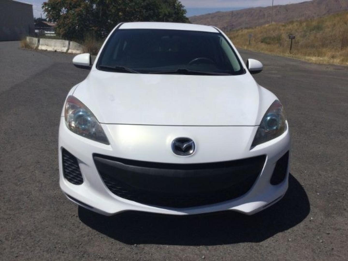 2012 Crystal White Pearl Mica /Black Mazda Mazda3 Hatchback i Touring (JM1BL1L72C1) with an SKYACTIV-G 2L I-4 gasoline direct injection engine, 6-Speed Automatic transmission, located at 1801 Main Street, Lewiston, 83501, (208) 743-9371, 46.417065, -117.004799- Photo#6