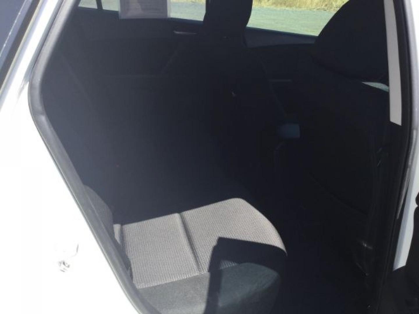2012 Crystal White Pearl Mica /Black Mazda Mazda3 Hatchback i Touring (JM1BL1L72C1) with an SKYACTIV-G 2L I-4 gasoline direct injection engine, 6-Speed Automatic transmission, located at 1801 Main Street, Lewiston, 83501, (208) 743-9371, 46.417065, -117.004799- Photo#7