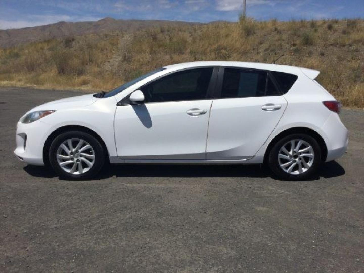 2012 Crystal White Pearl Mica /Black Mazda Mazda3 Hatchback i Touring (JM1BL1L72C1) with an SKYACTIV-G 2L I-4 gasoline direct injection engine, 6-Speed Automatic transmission, located at 1801 Main Street, Lewiston, 83501, (208) 743-9371, 46.417065, -117.004799- Photo#13