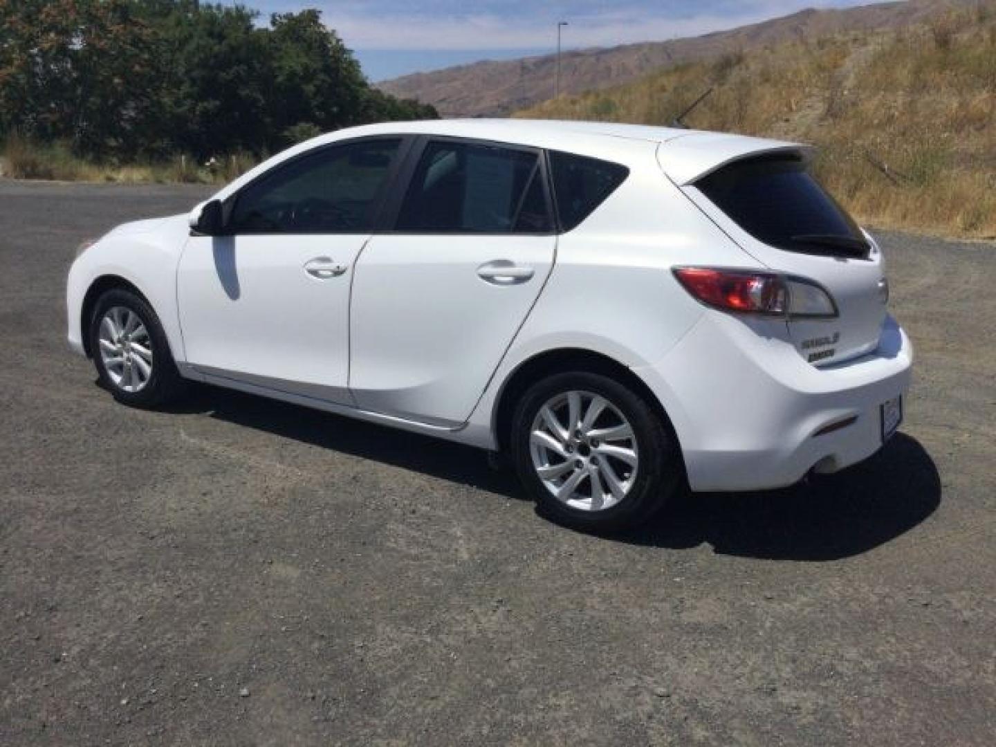 2012 Crystal White Pearl Mica /Black Mazda Mazda3 Hatchback i Touring (JM1BL1L72C1) with an SKYACTIV-G 2L I-4 gasoline direct injection engine, 6-Speed Automatic transmission, located at 1801 Main Street, Lewiston, 83501, (208) 743-9371, 46.417065, -117.004799- Photo#14