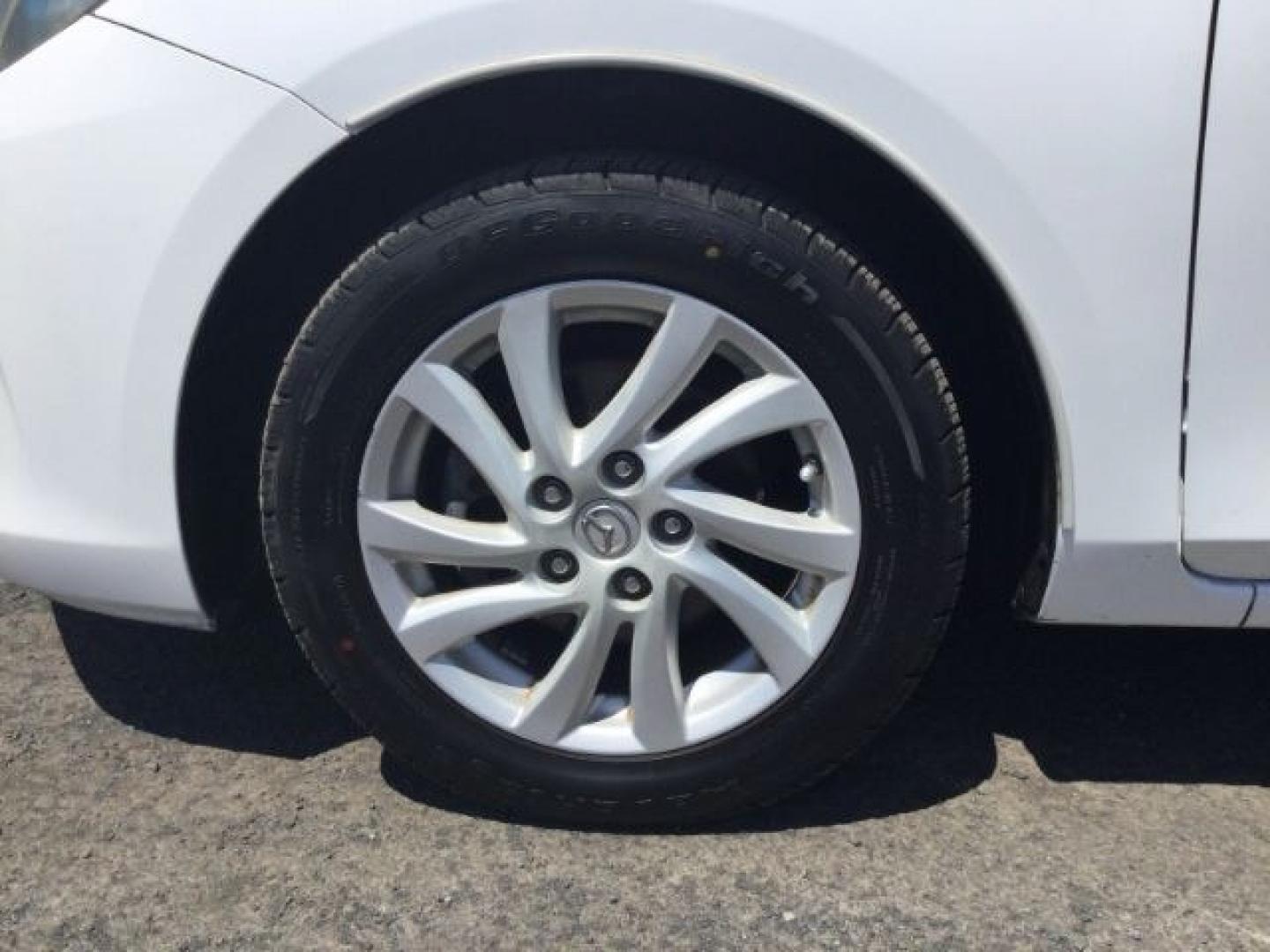 2012 Crystal White Pearl Mica /Black Mazda Mazda3 Hatchback i Touring (JM1BL1L72C1) with an SKYACTIV-G 2L I-4 gasoline direct injection engine, 6-Speed Automatic transmission, located at 1801 Main Street, Lewiston, 83501, (208) 743-9371, 46.417065, -117.004799- Photo#16
