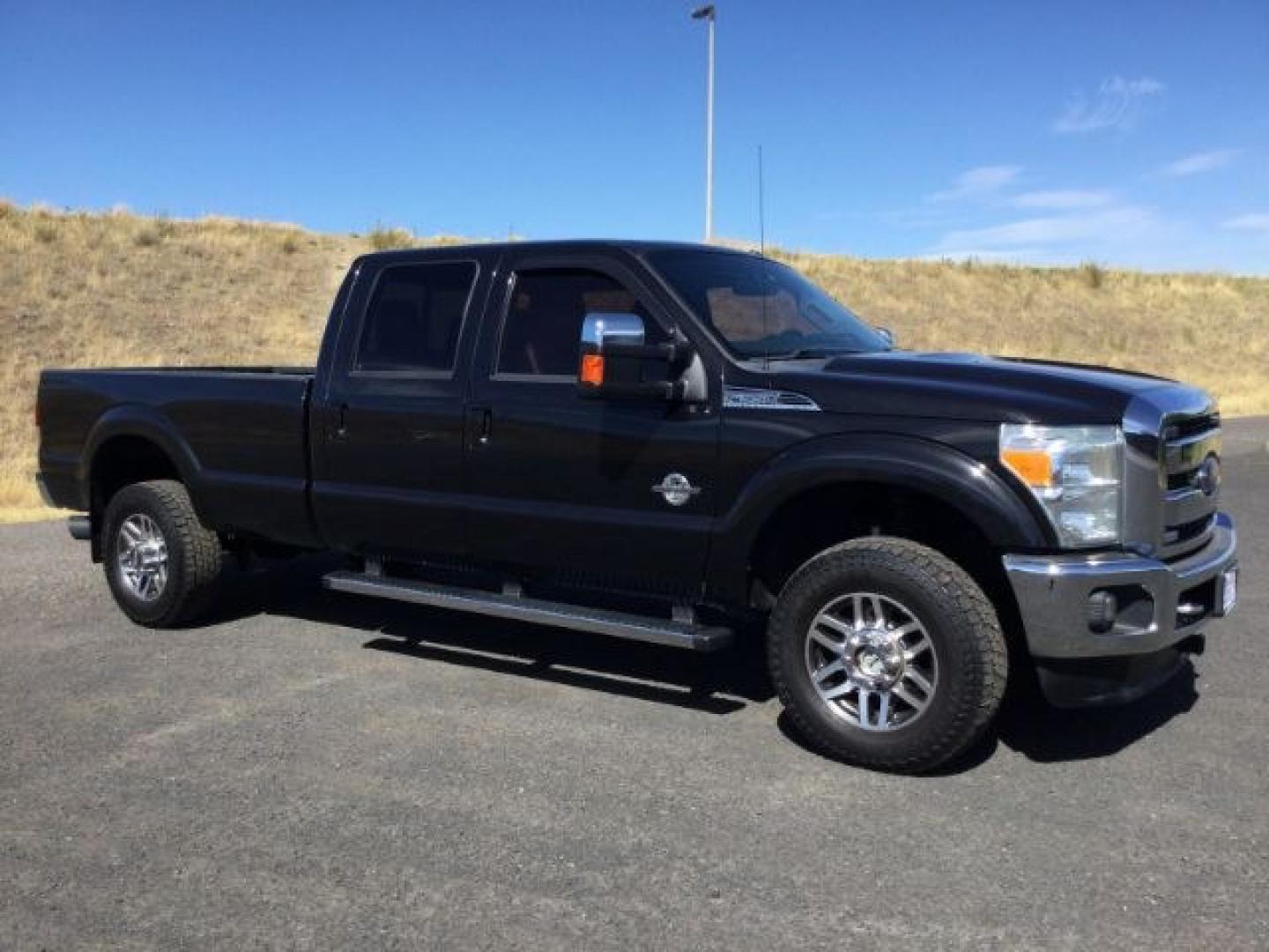 2014 Tuxedo Black Metallic /Black Ford F-350 LARIAT (1FT8W3BTXEE) with an Powerstroke 6.7L V-8 diesel direct injection engine, 6-Speed Automatic transmission, located at 1801 Main Street, Lewiston, 83501, (208) 743-9371, 46.417065, -117.004799- Photo#0