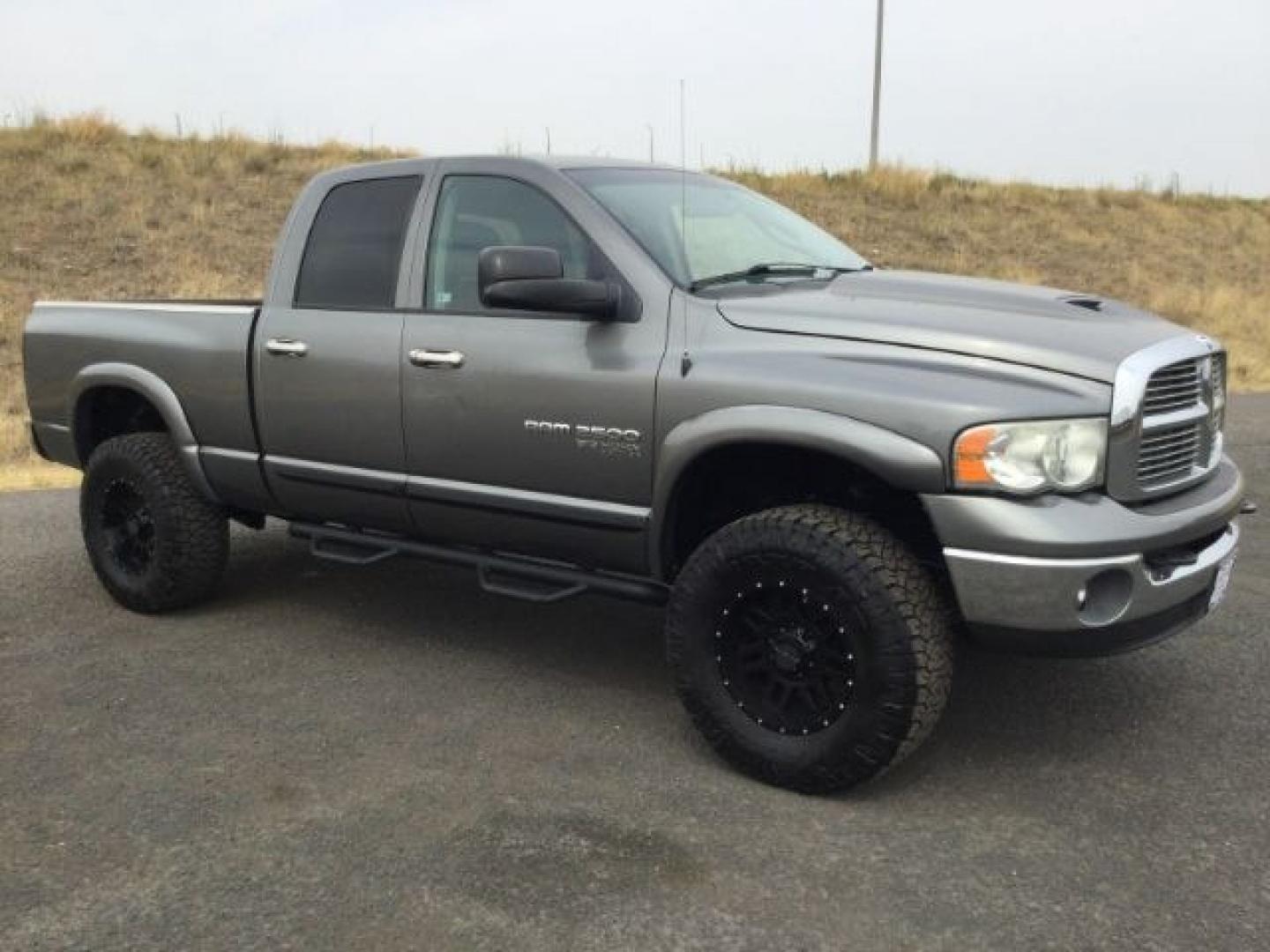 2005 Mineral Gray Metallic Clearcoat /Dark Slate Gray Dodge Ram 2500 SLT Quad Cab (3D7KS28C25G) with an Cummins 5.9L I-6 diesel direct injection engine, 4 speed automatic transmission, located at 1801 Main Street, Lewiston, 83501, (208) 743-9371, 46.417065, -117.004799- Photo#0