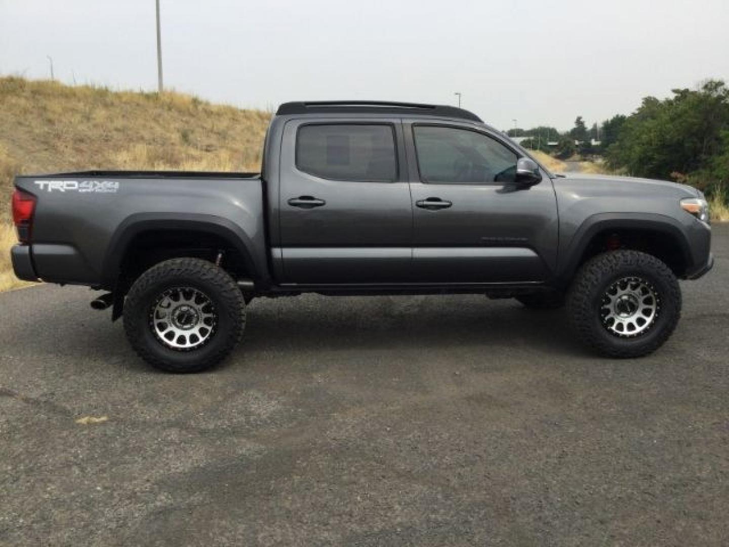 2018 Magnetic Gray Metallic Toyota Tacoma TRD Off Road (3TMCZ5AN5JM) with an 3.5L V-6 port/direct injection engine, located at 1801 Main Street, Lewiston, 83501, (208) 743-9371, 46.417065, -117.004799- Photo#20