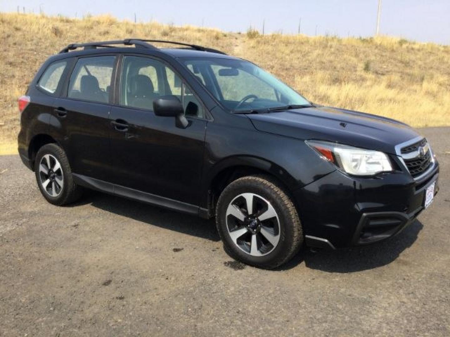 2018 Crystal Black Silica /Black Subaru Forester 2.5i (JF2SJABC3JH) with an 2.5L H-4 DOHC engine, CVT Automatic transmission, located at 1801 Main Street, Lewiston, 83501, (208) 743-9371, 46.417065, -117.004799- Photo#0