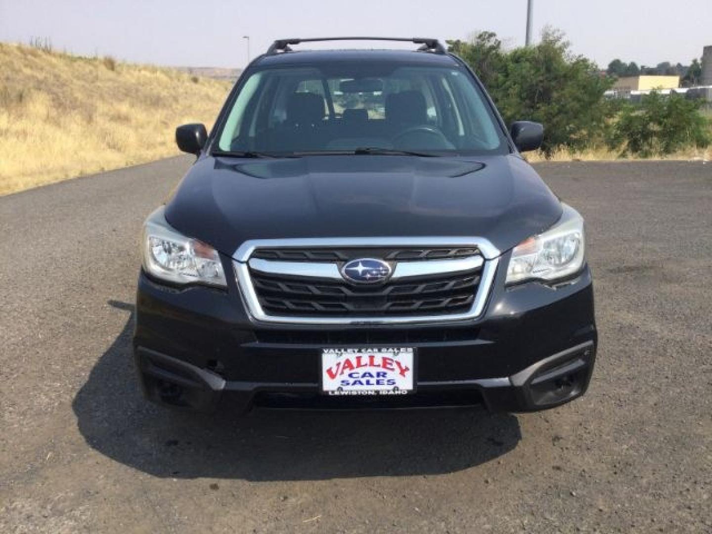 2018 Crystal Black Silica /Black Subaru Forester 2.5i (JF2SJABC3JH) with an 2.5L H-4 DOHC engine, CVT Automatic transmission, located at 1801 Main Street, Lewiston, 83501, (208) 743-9371, 46.417065, -117.004799- Photo#2