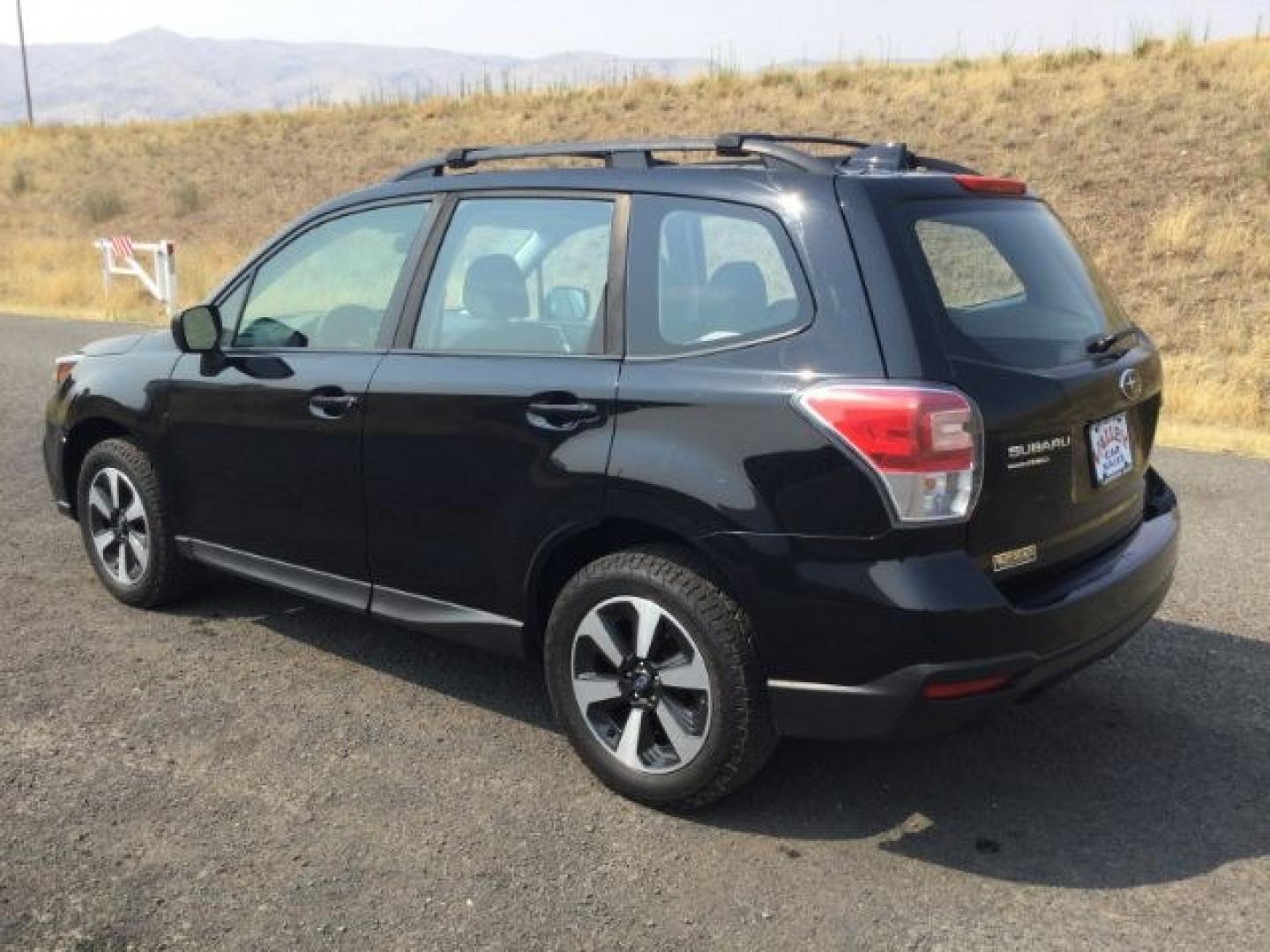 2018 Crystal Black Silica /Black Subaru Forester 2.5i (JF2SJABC3JH) with an 2.5L H-4 DOHC engine, CVT Automatic transmission, located at 1801 Main Street, Lewiston, 83501, (208) 743-9371, 46.417065, -117.004799- Photo#4