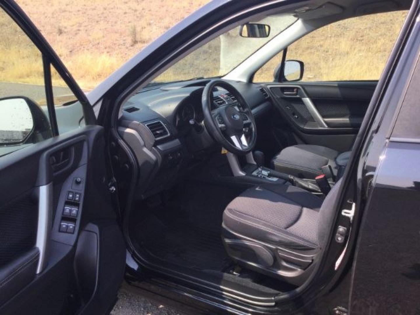 2018 Crystal Black Silica /Black Subaru Forester 2.5i (JF2SJABC3JH) with an 2.5L H-4 DOHC engine, CVT Automatic transmission, located at 1801 Main Street, Lewiston, 83501, (208) 743-9371, 46.417065, -117.004799- Photo#6