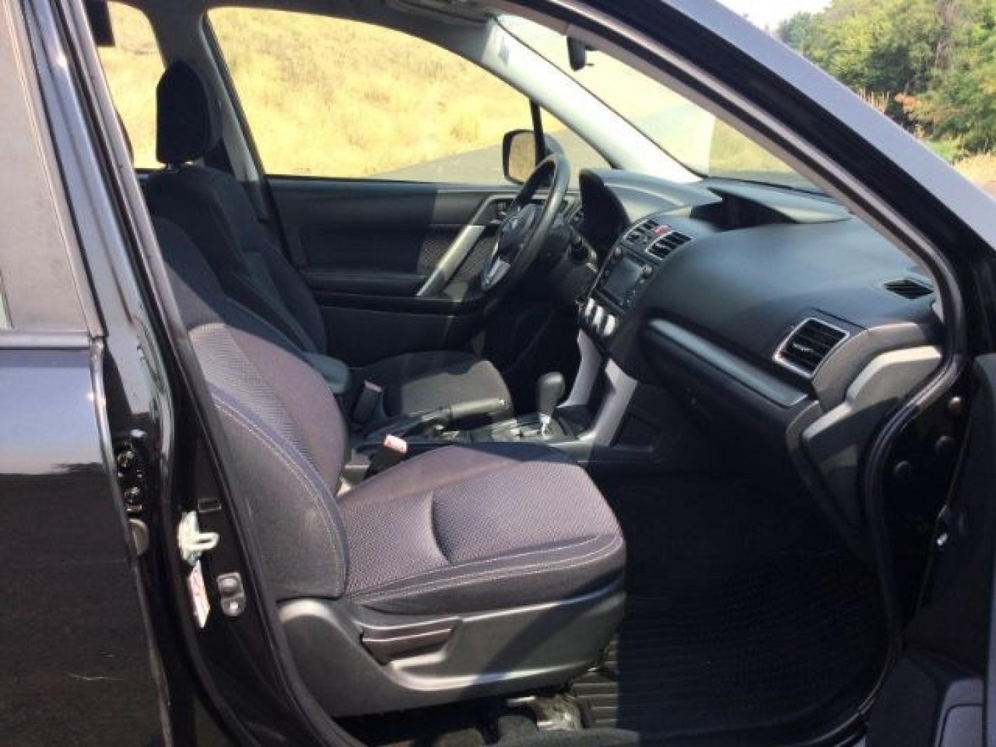 2018 Crystal Black Silica /Black Subaru Forester 2.5i (JF2SJABC3JH) with an 2.5L H-4 DOHC engine, CVT Automatic transmission, located at 1801 Main Street, Lewiston, 83501, (208) 743-9371, 46.417065, -117.004799- Photo#8